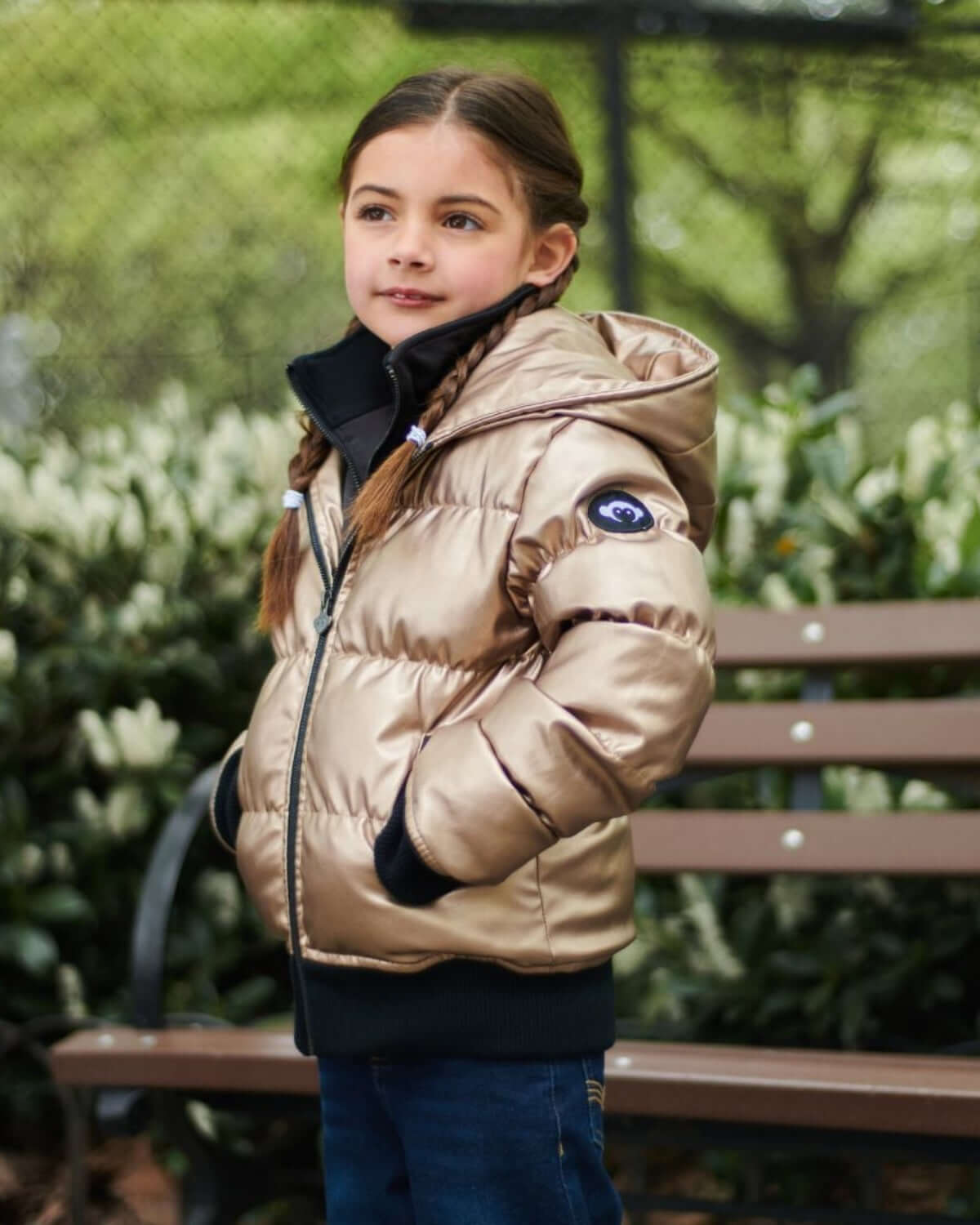 Stylish girl in a cozy copper shine Flurry Coat, perfect for chilly days and back-to-school vibes!