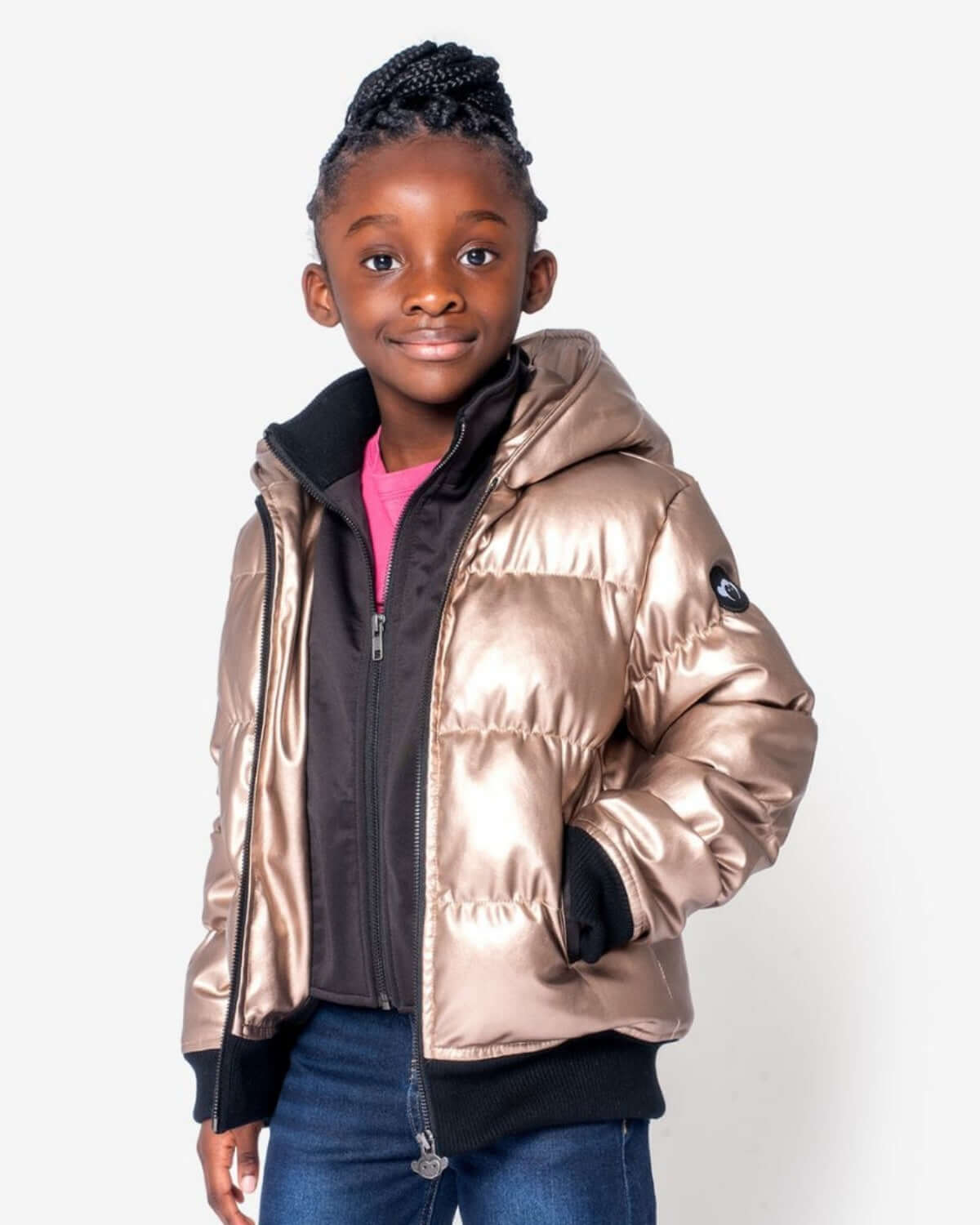 Girl wearing the Copper Shine Flurry Coat, a stylish insulated jacket with a hood and weather-resistant features.