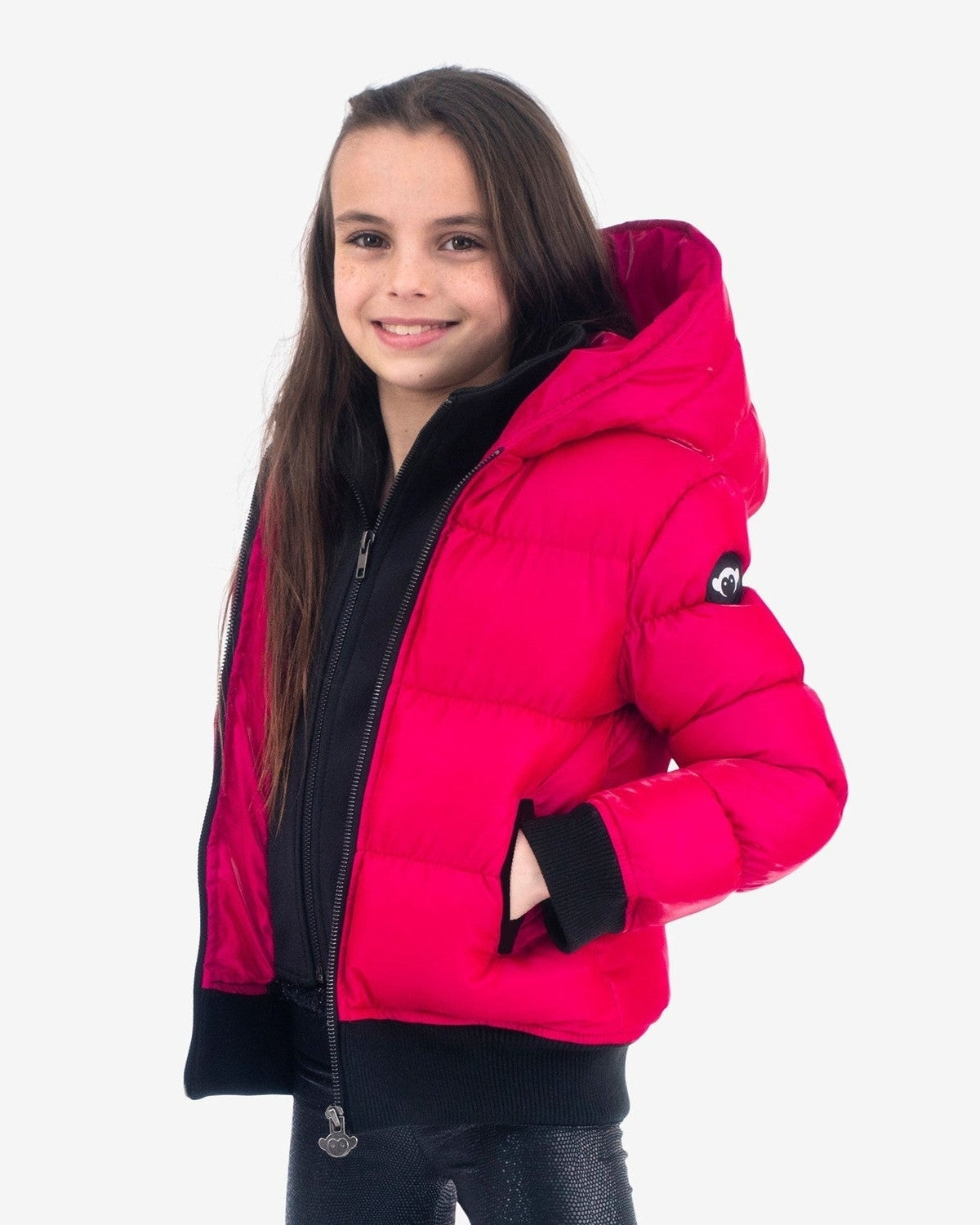 Stylish girl rocking the Fuchsia Flurry Coat; warmth meets chic for back to school adventures in high-quality kids clothes.