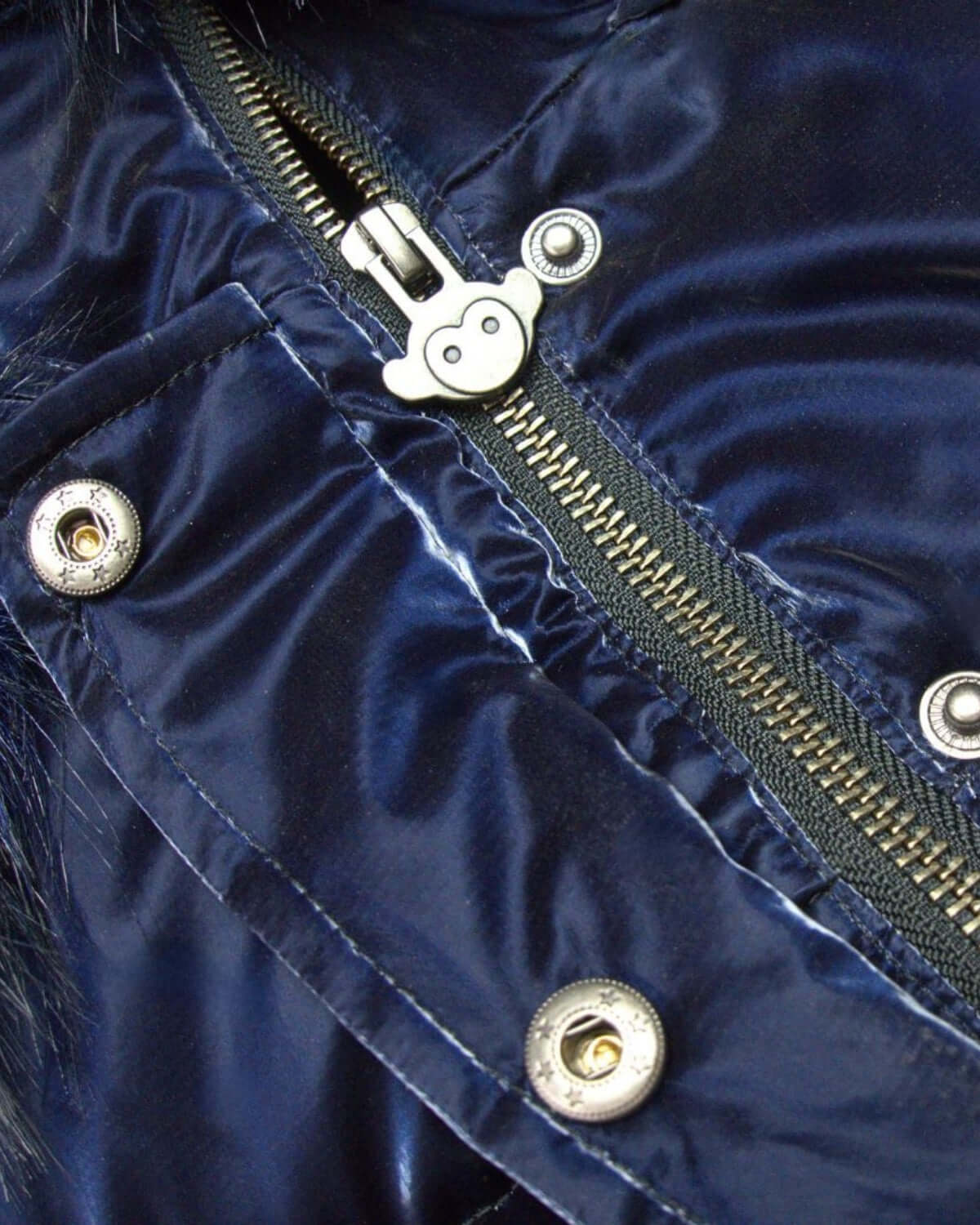 Close-up of the cozy navy fabric and playful zipper detail on the Kyla Puffer Coat—stylish warmth for winter adventures!