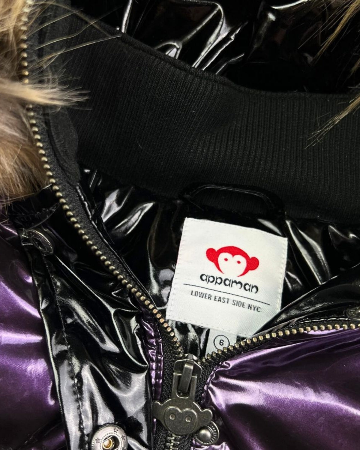 Inside label of the trendy Plum/Black Kyla Puffer Coat from Appaman—stylish kids clothes fused with warm winter fun!