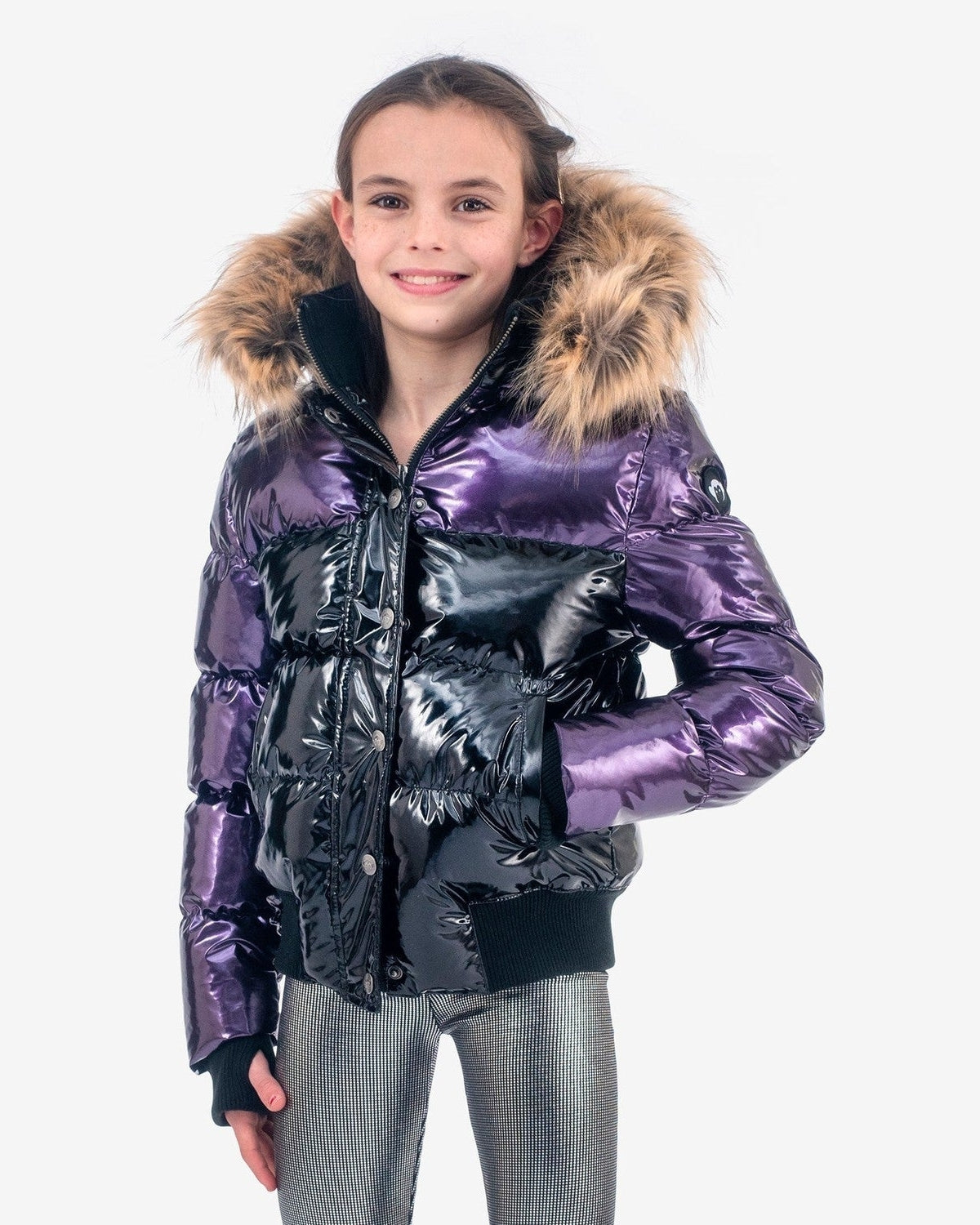 Stylish girl in a plum and black Kyla Puffer Coat with faux fur hood, perfect for winter adventures and back-to-school fun.