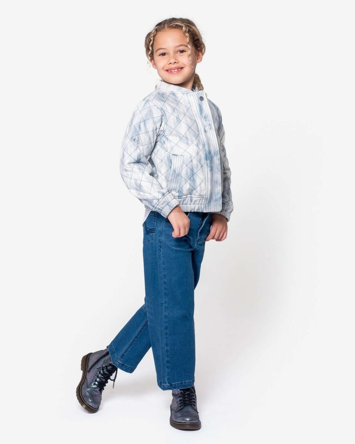 Stylish kid in Appaman's Washed Denim Hazel Jean Jacket, rocking high-quality kids clothes with playful charm.