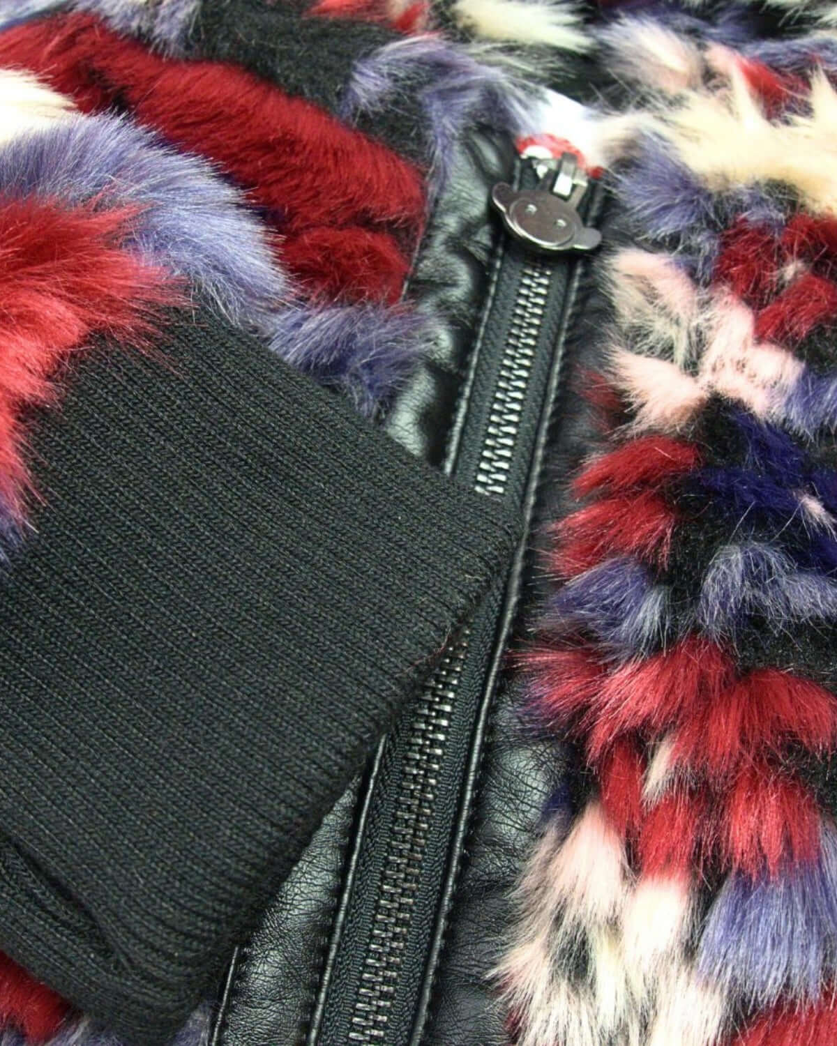 Colorful close-up of the Appaman Winter Floral Luna Hoodie Jacket's plush fabric and chic faux leather zipper.