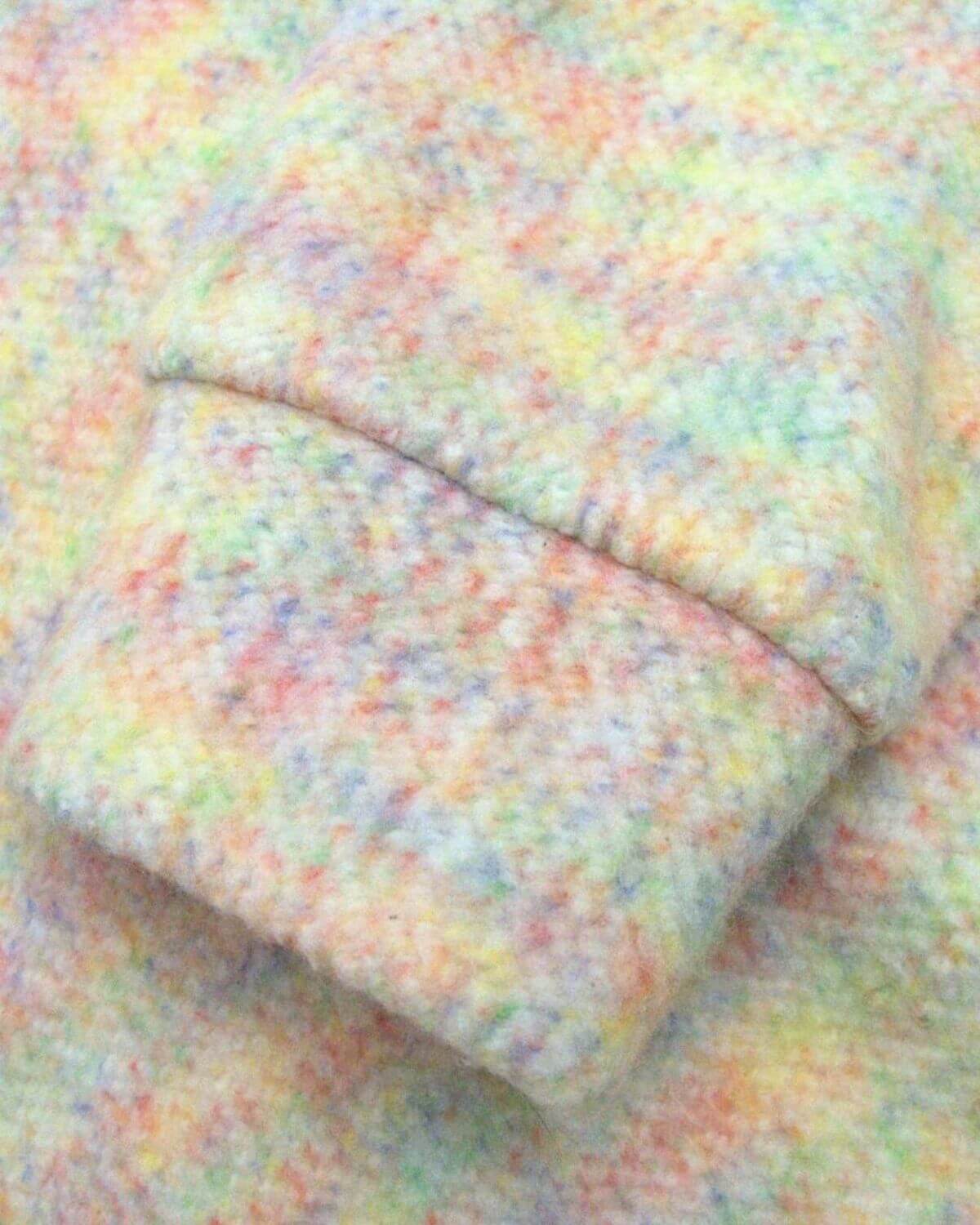 Close-up of the soft, multi-color fabric of the Lightning Bolt Ruby Sweatshirt, perfect for stylish kids' clothes.