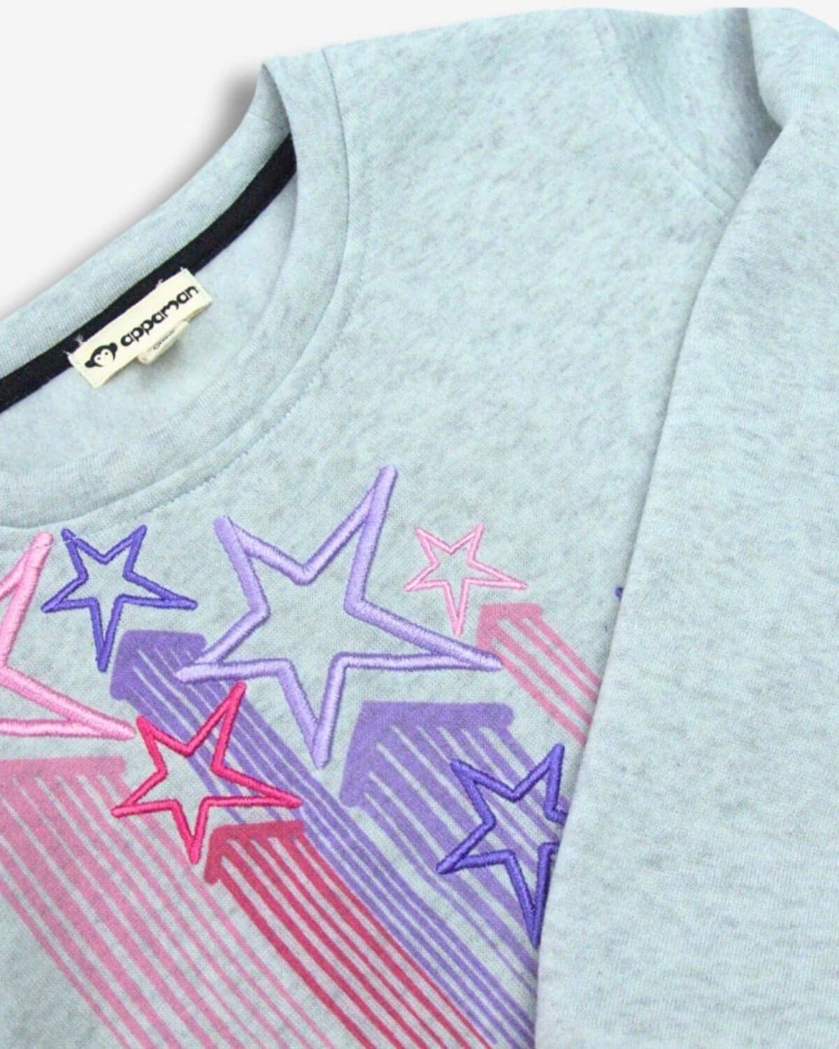 Stylish Heather Grey Ruby sweatshirt with vibrant star details, perfect for kids on the go this back to school season.