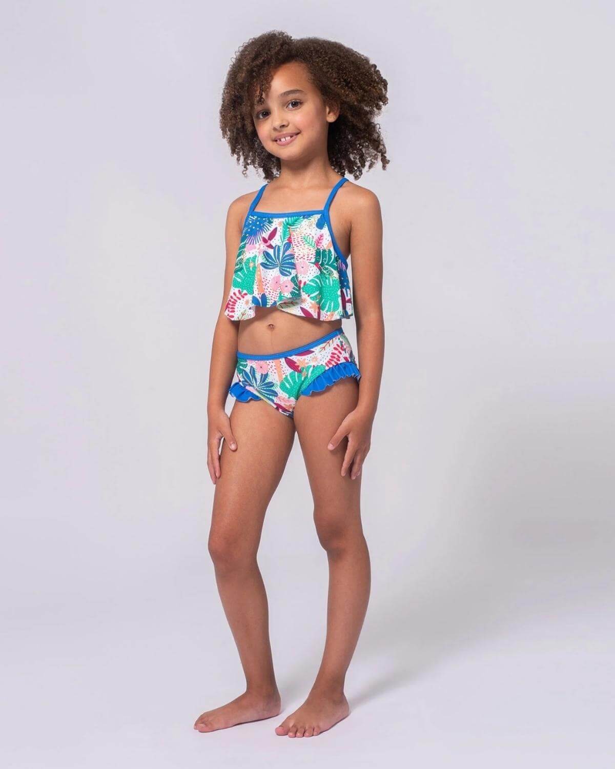 Stylish girl in a floral bikini set, ready for summer fun and beach adventures. High-quality kids clothes that shine!