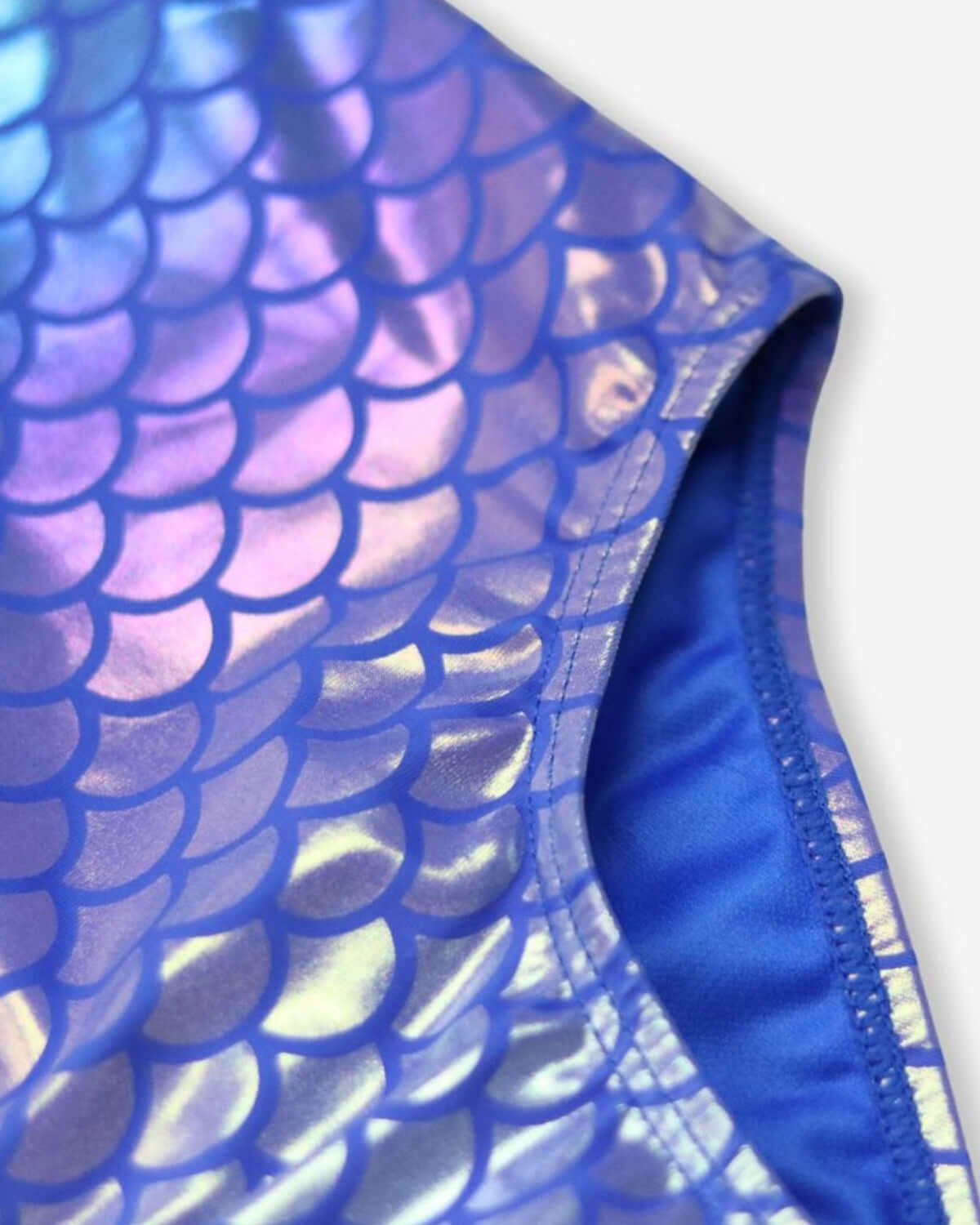 Close-up of the iridescent mermaid swimsuit, featuring shimmering scales in vibrant blues and purples—perfect for summer adventures!