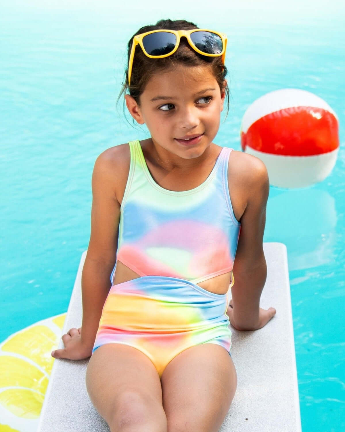 Bright and bubbly Multi Erika Swimsuit for girls, perfect for sunny days by the pool—stylish, fun, and UPF 50+!
