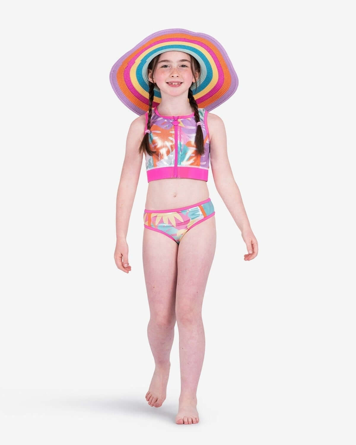 Confident girl in Appaman's Palm Beach Sophie Bikini, flaunting playful palm prints and a stylish sun hat for summer fun!