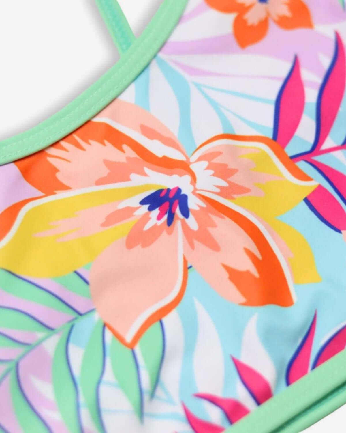 Vibrant floral pattern of the Retro Tropics Stella Bikini, perfect for kids' summer adventures in style!