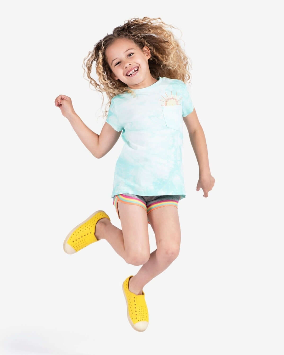 Joyful girl in Aqua Cloud Pocket Tee, brightening her day with playful style for back to school adventures.