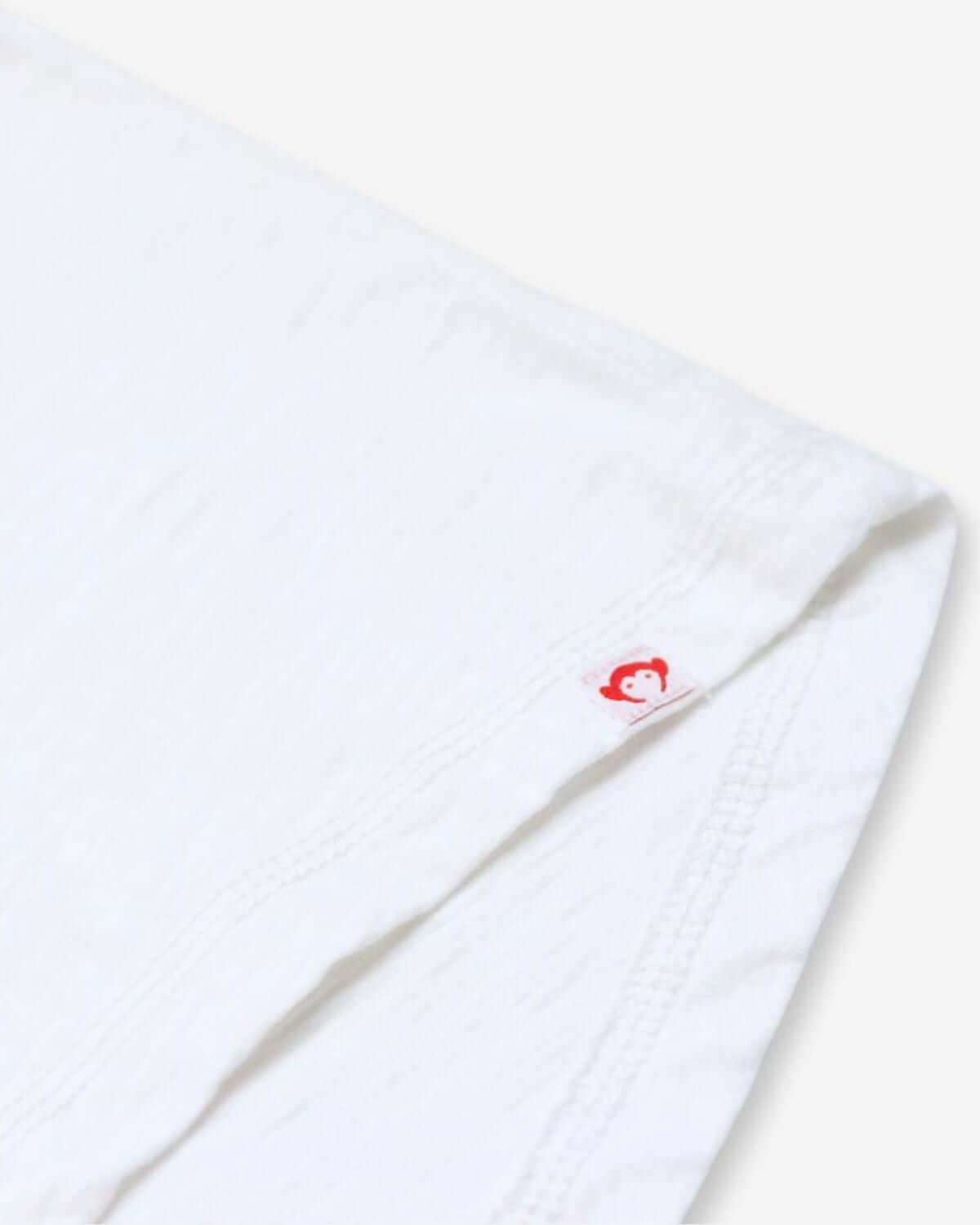 Stylish quality white fabric close-up of the Beach Love Circle Tee—ideal for sunny fun and stylish adventures!