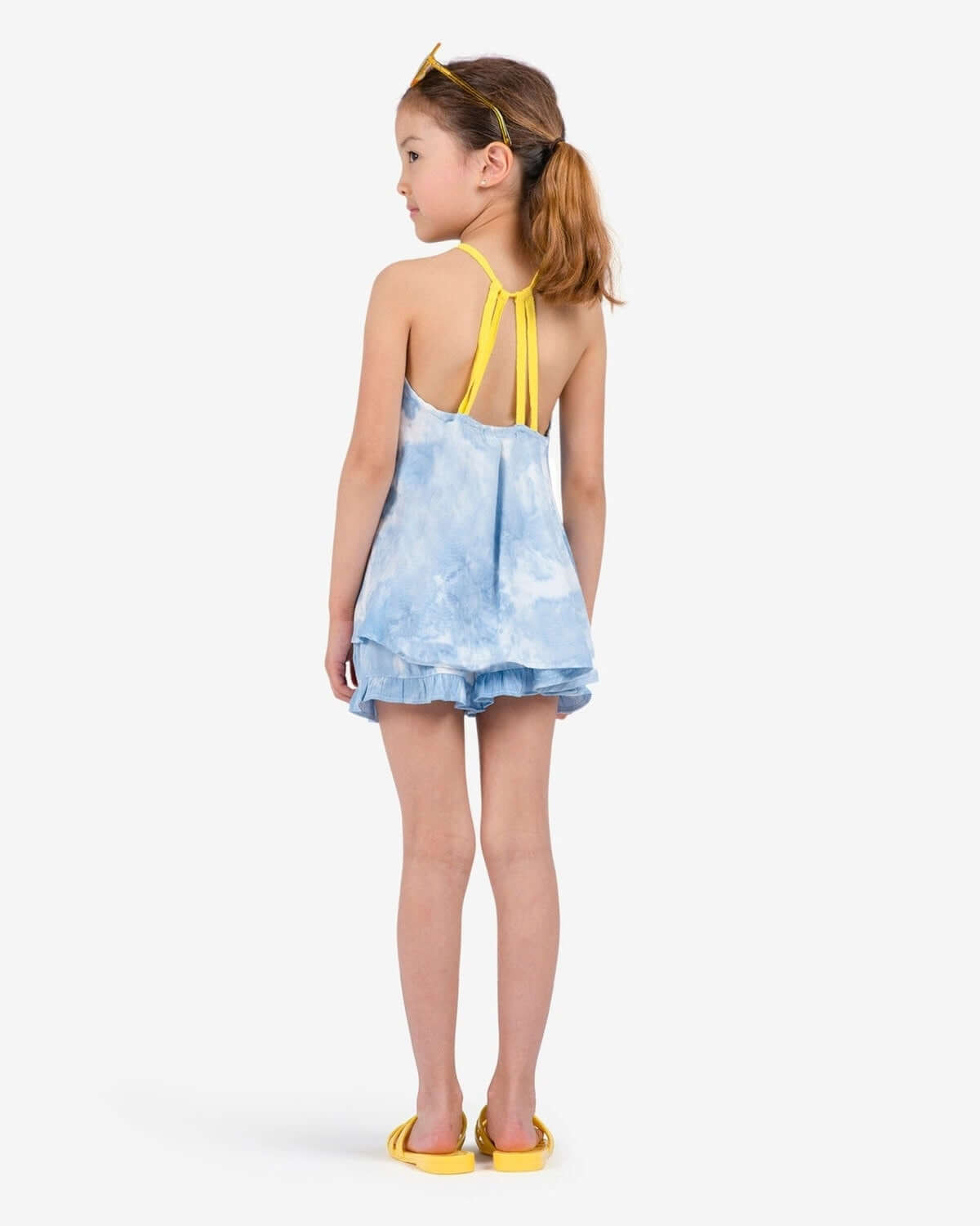 Little one rocking the Sanibel Tank in dreamy blue, perfectly playful for beach days and sunny adventures!