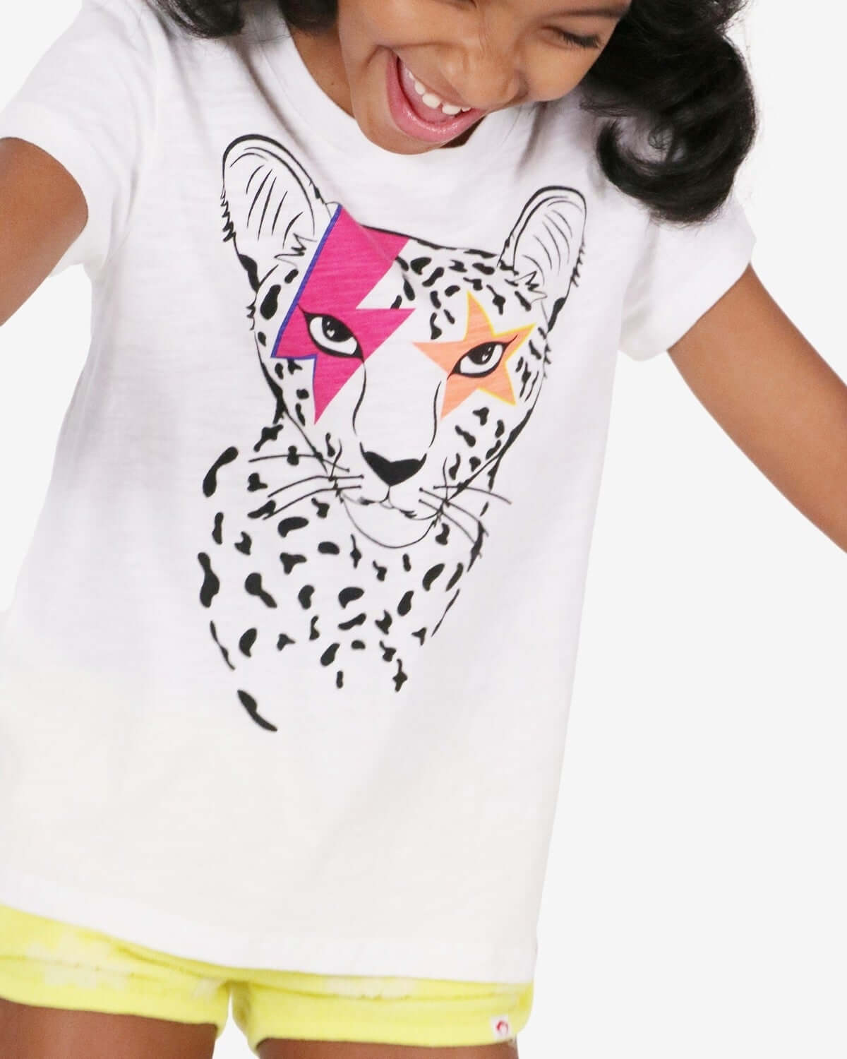 Playful girl in Cheetah Circle Tee, showcasing fierce style for kids' fashion—perfect for back to school adventures!