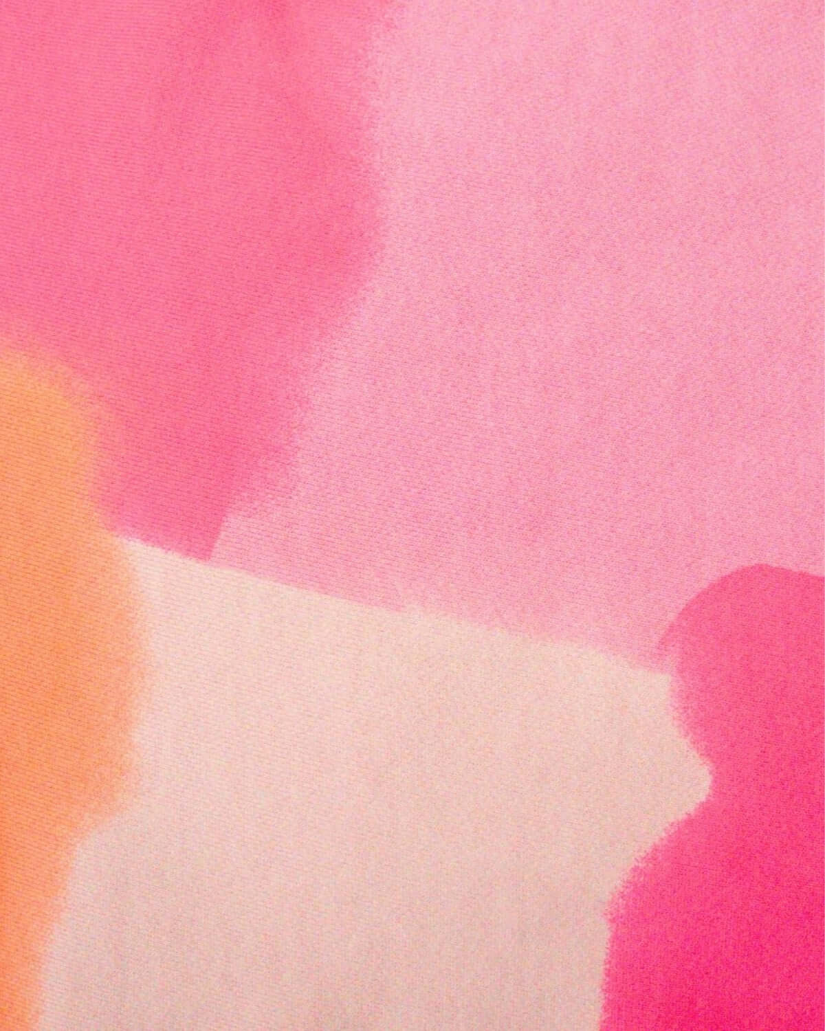 Vibrant orange and pink color block patterns, showcasing stylish kids clothes for a fun back-to-school look.