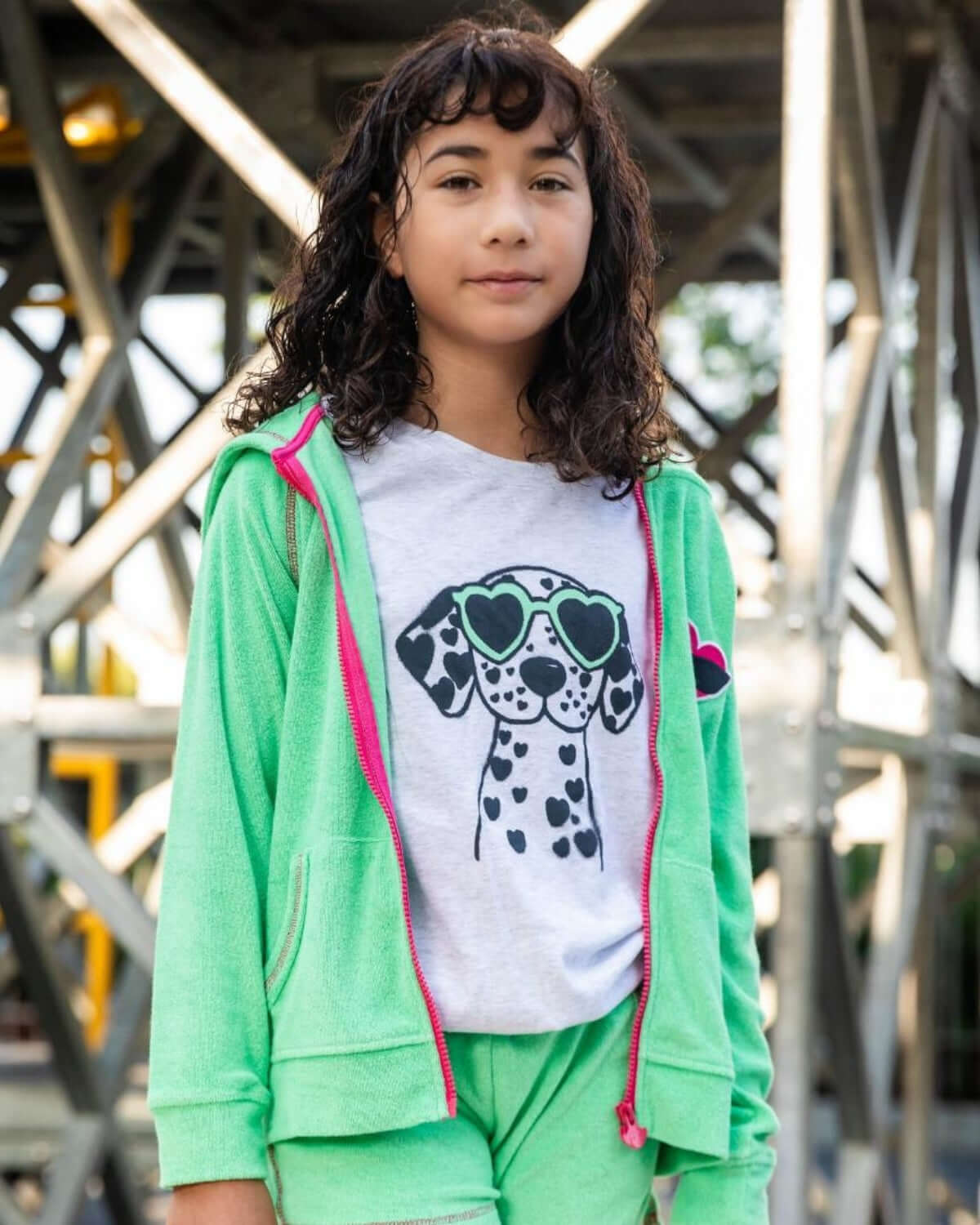 Stylish kid in a mint hoodie and playful dalmatian tee, ready for school adventures in high-quality kids clothes.