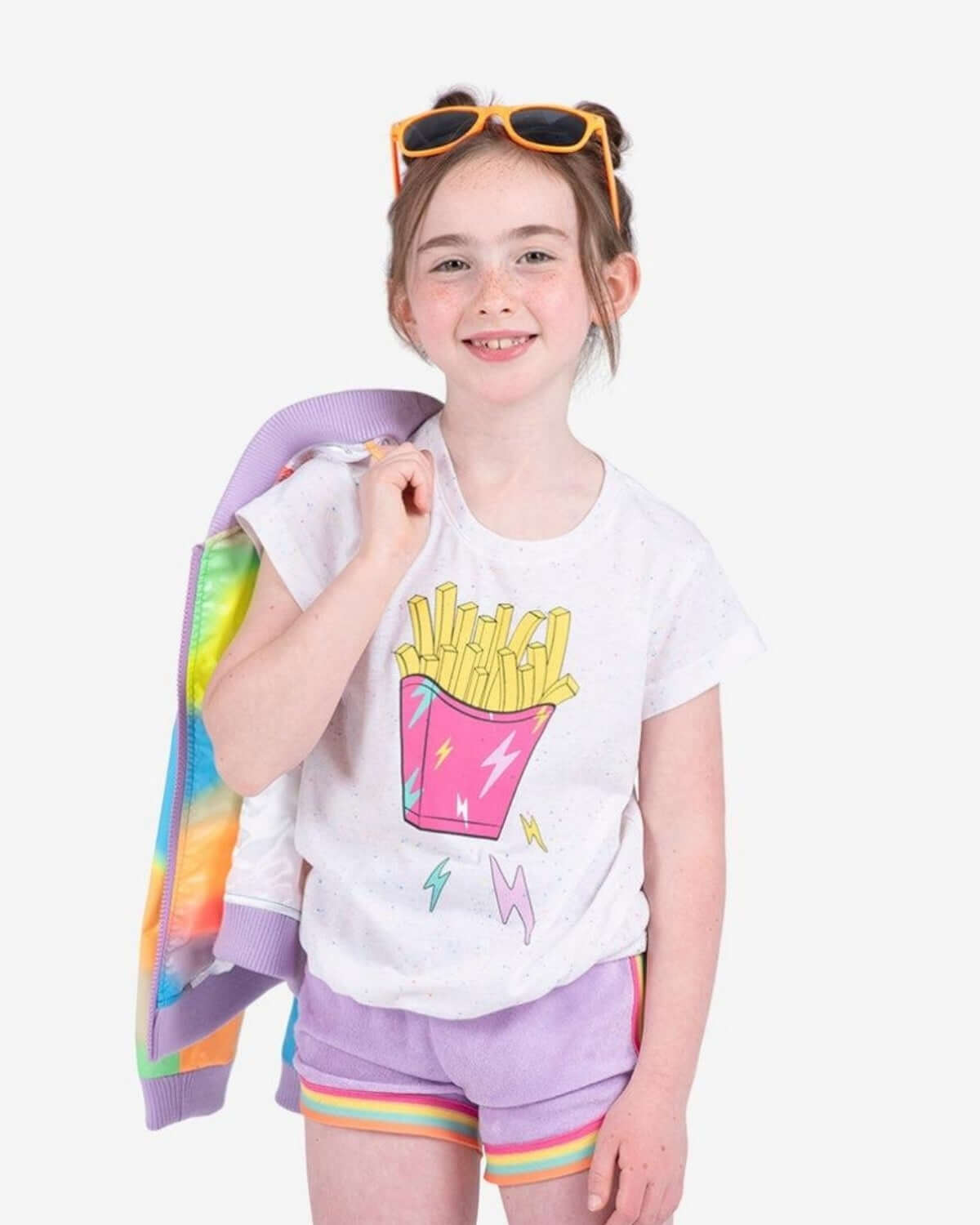 Bright-eyed girl rocking a fun fries Callaway Tee, playful speckles, and lightning bolts for a stylish back-to-school look!