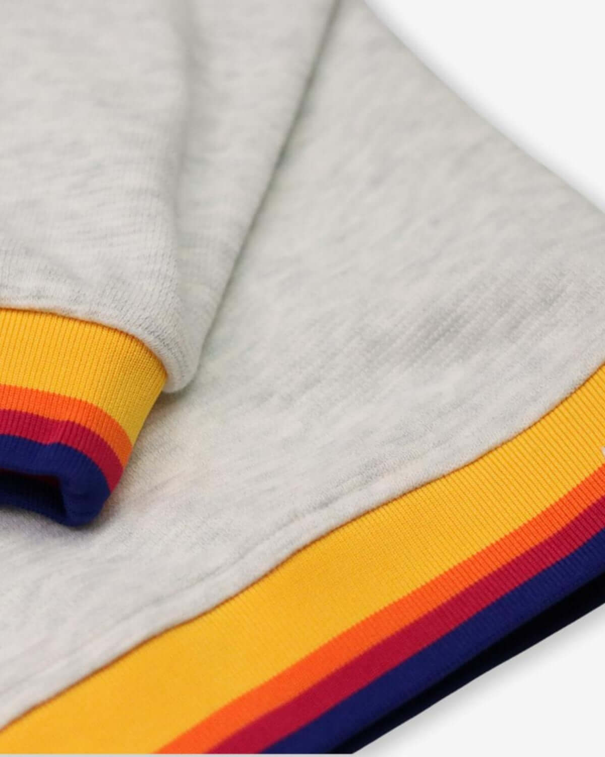 Close-up of the Happy Surfing Ruby Sweatshirt's colorful ribbed cuffs, showcasing stylish stripes for cool kids!