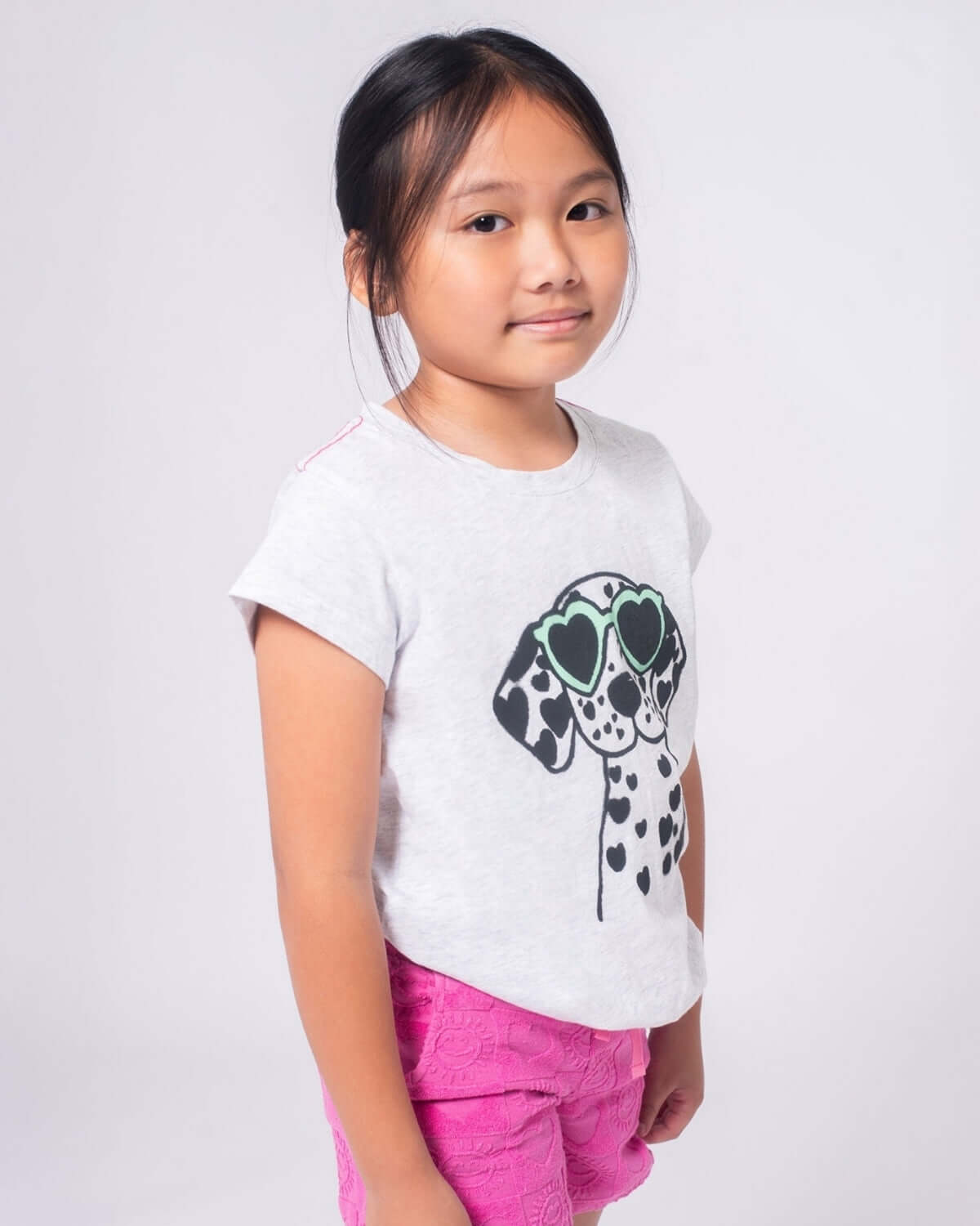 Stylish girl in a playful Dalmatian tee, ready for fun in high-quality kids clothes. Perfect for back-to-school adventures!