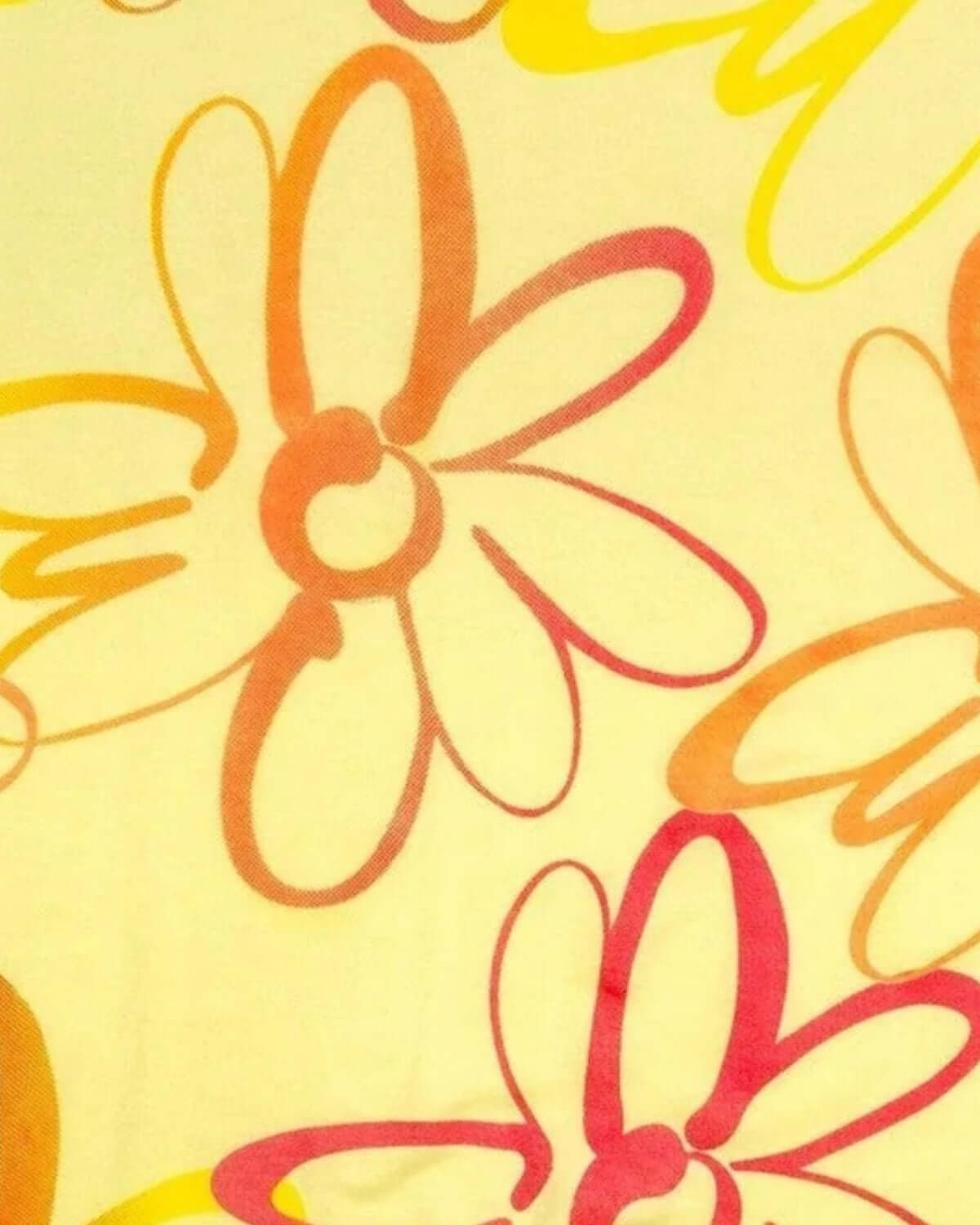 Close-up of vibrant multicolor daisies on soft fabric, perfect for stylish kids' summer outfits.