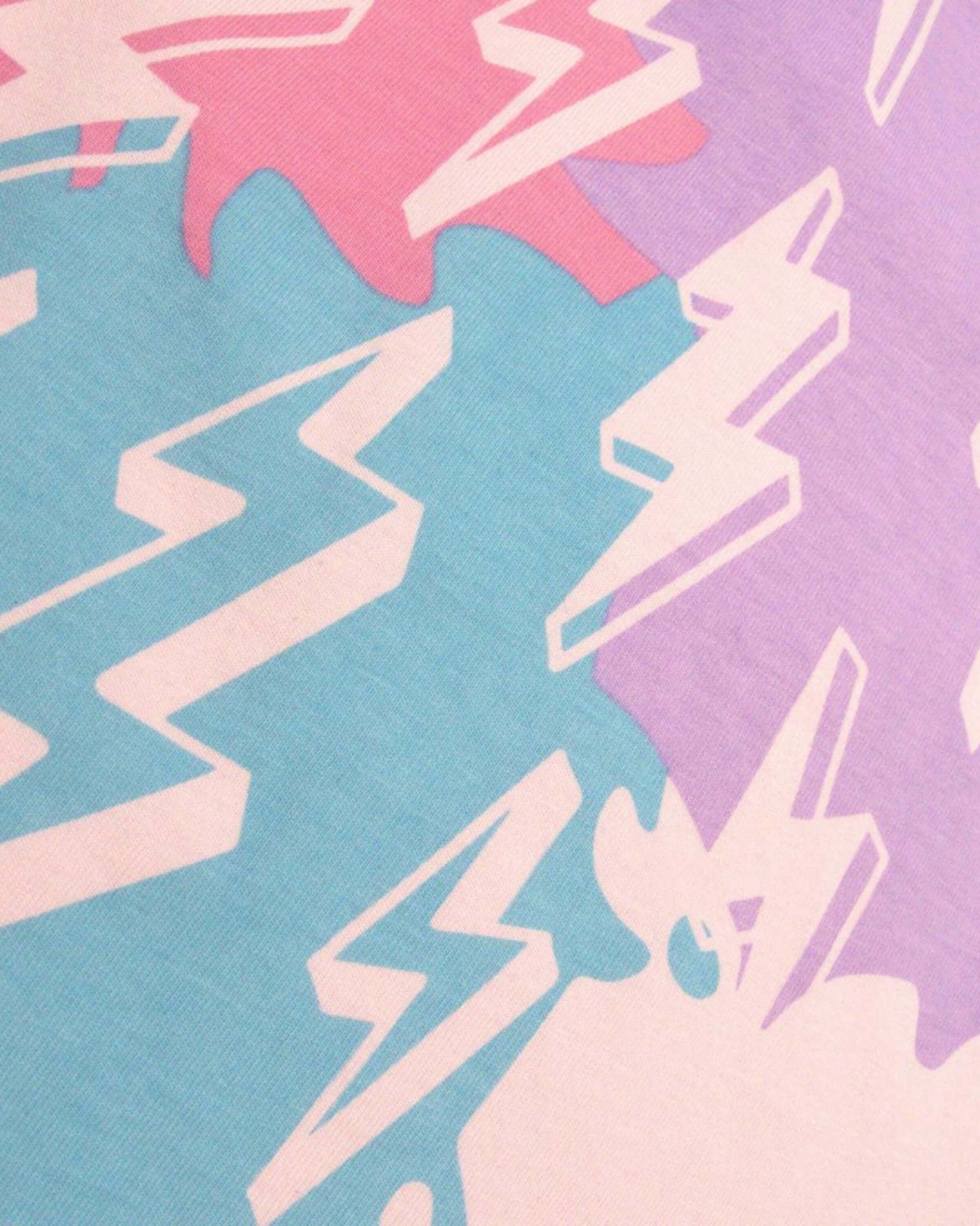 Vibrant paint splashes and lightning bolts in pink and blue on high-quality cotton for stylish kids' fashion.