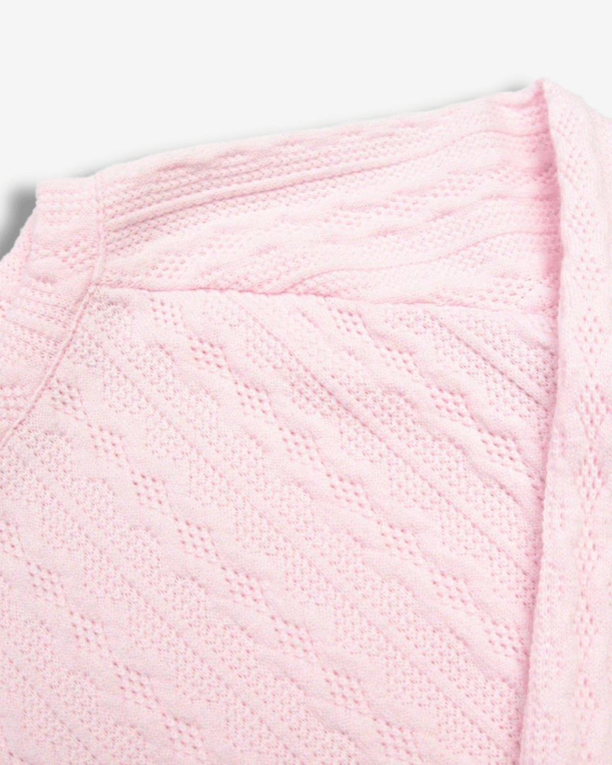 Soft pale pink cable knit texture of the Ruslana Top—stylish kids clothes for back to school adventures!