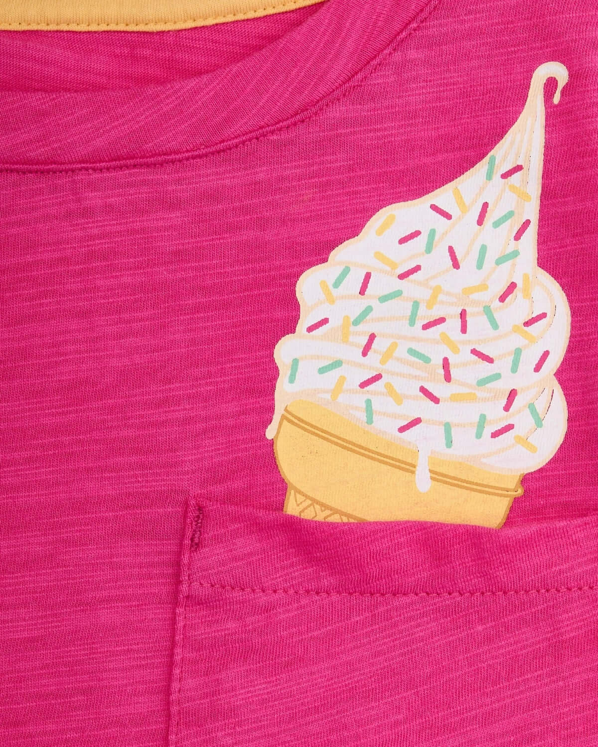 Close-up of vibrant fuchsia tee featuring playful ice cream cone design, perfect for stylish kids' outfits.
