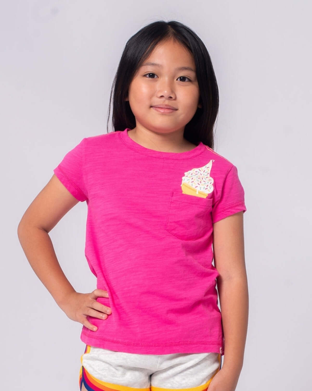 Vibrant fuchsia kids tee featuring playful ice cream design, perfect for stylish boys and girls. High-quality and durable!