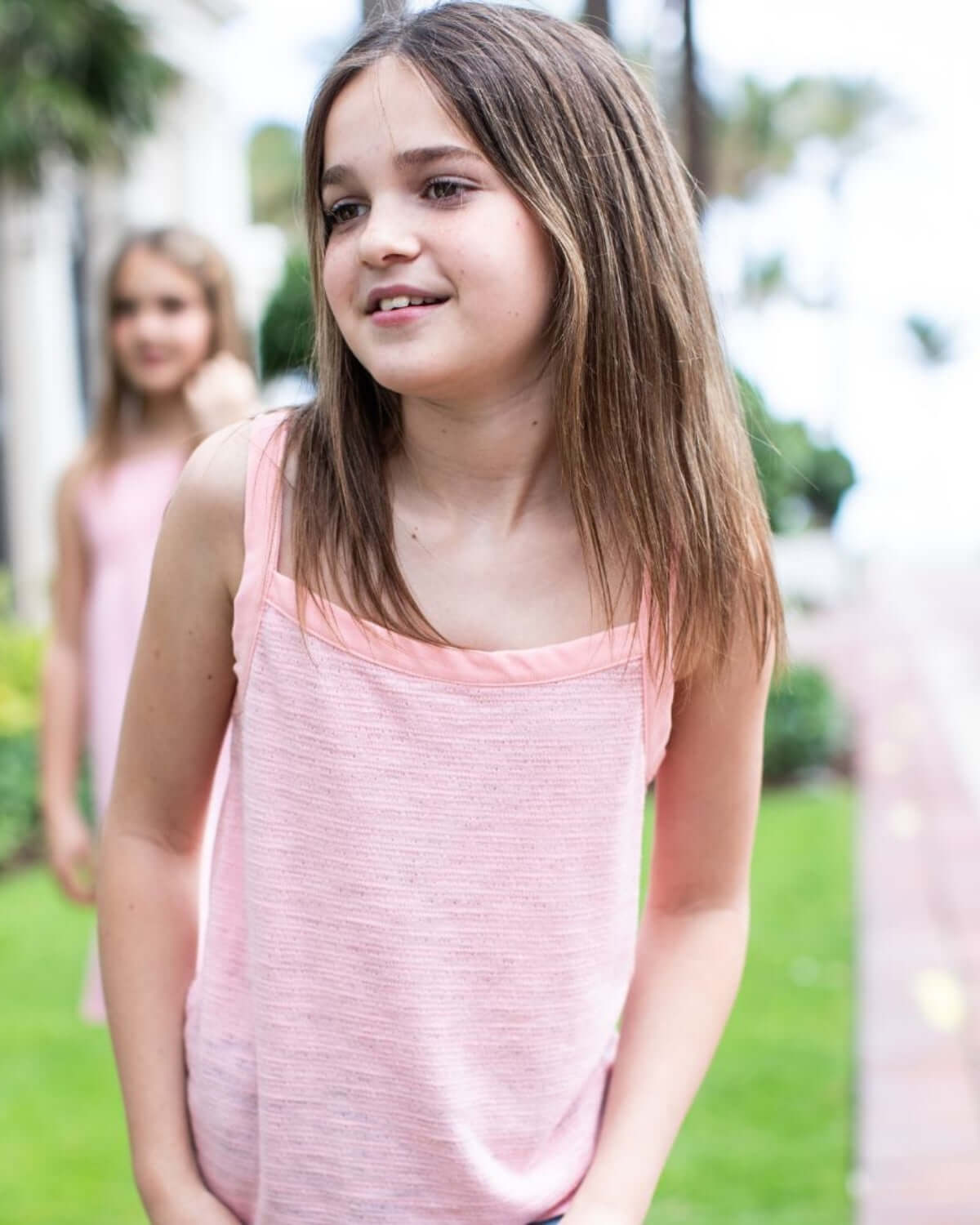 Soft Pink Hannah Bow Tank on a girl enjoying outdoor play, featuring a stylish and comfortable design.