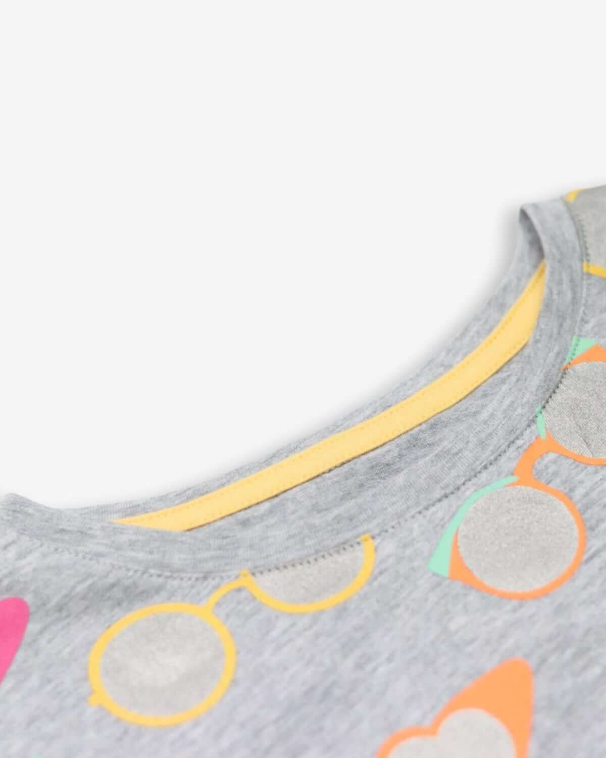 Light grey kids t-shirt with fun sunglasses print and vibrant neckline—stylish, comfy, and perfect for school adventures!