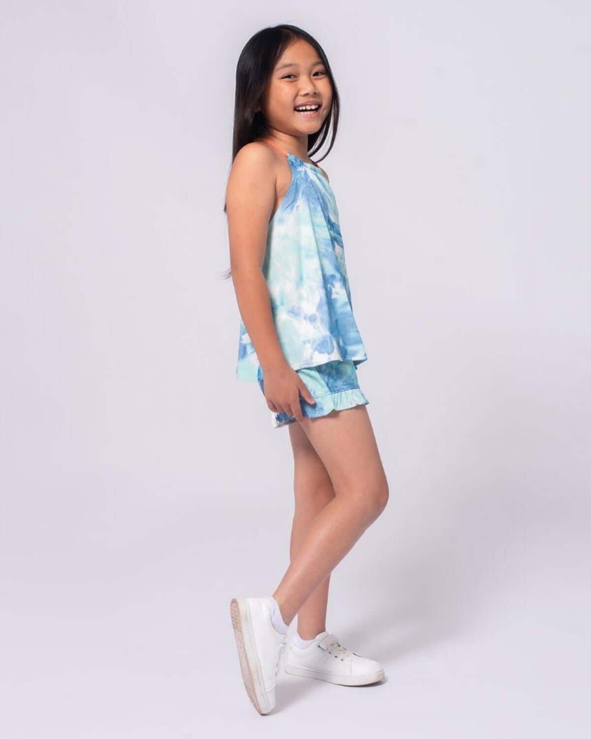 Brighten up her summer style in this fun watercolor turquoise tank & shorts set—perfect for playful days!