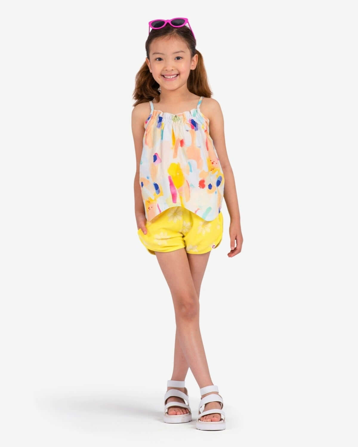 Bright and cheerful girl in Appaman's Watercolor Harper Top, perfect summer vibes in high-quality kids clothes.
