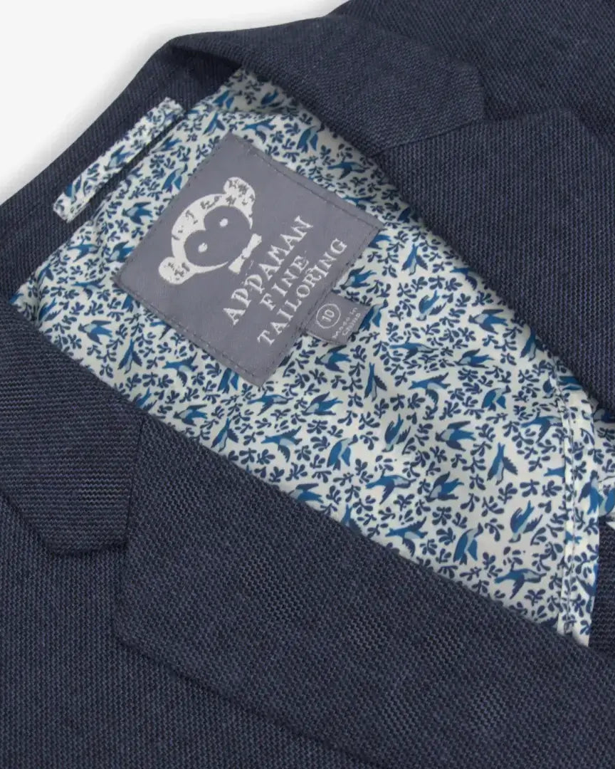 Stylish inside view of Appaman's Blue Nights Linen Trouser Shorts Suit, boasting playful patterns for chic kids clothes.