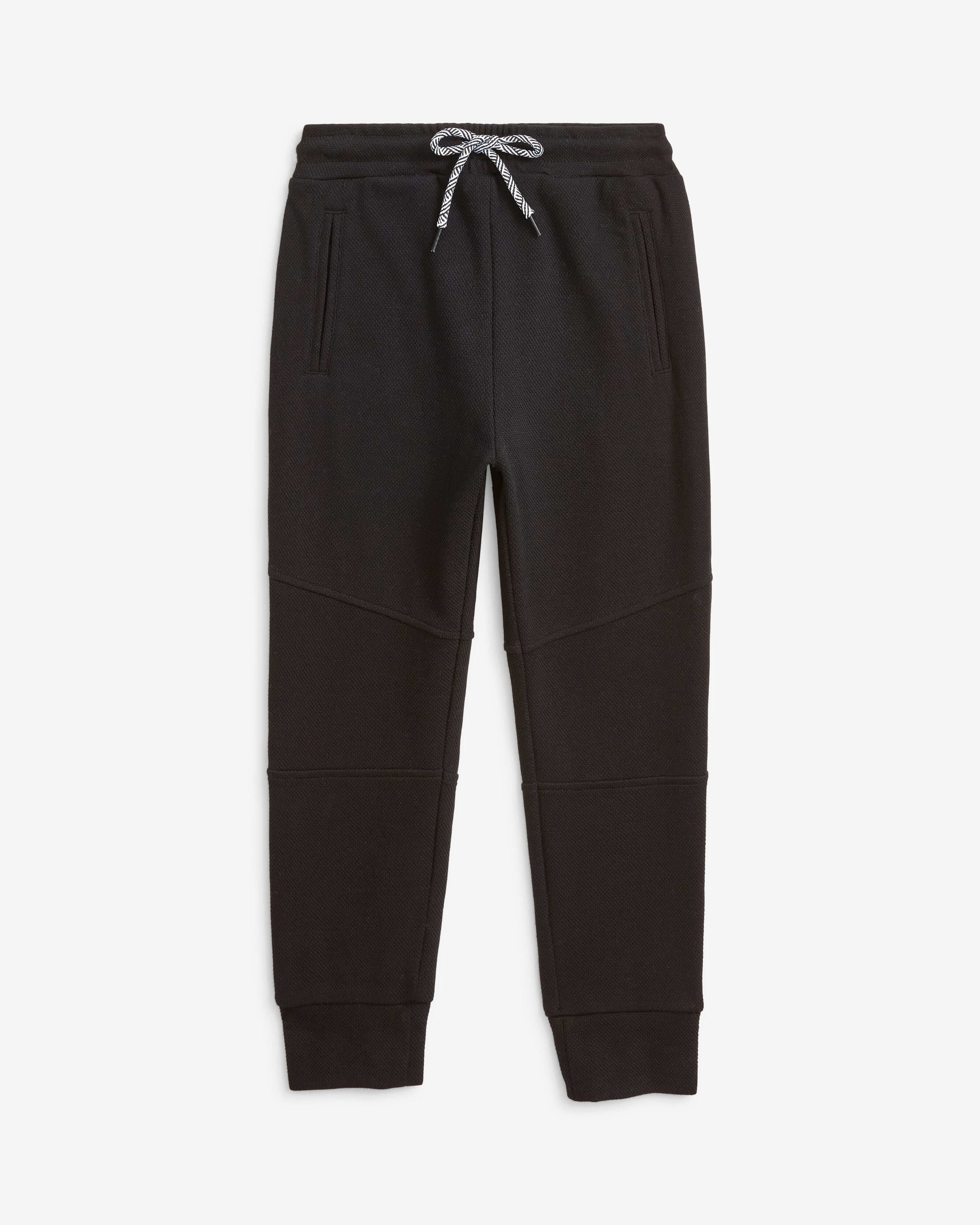 Kids' trendy black sweatpants—soft, durable, with pockets for treasures; perfect for play, lounging, and stylish adventures!