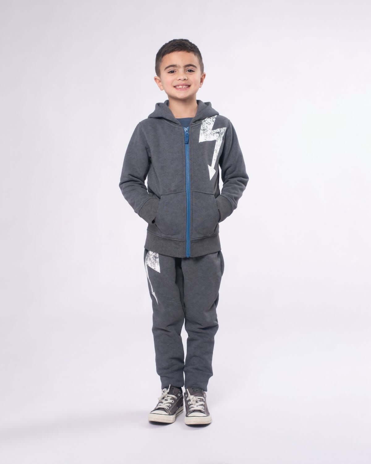 Stylish boy in a washed grey hoodie and matching joggers, perfect for kids' back-to-school outfits!