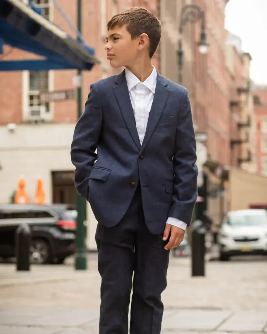 Stylish boy in a blue linen suit, exuding confidence and charm—ideal kids clothes for back to school with a modern twist!