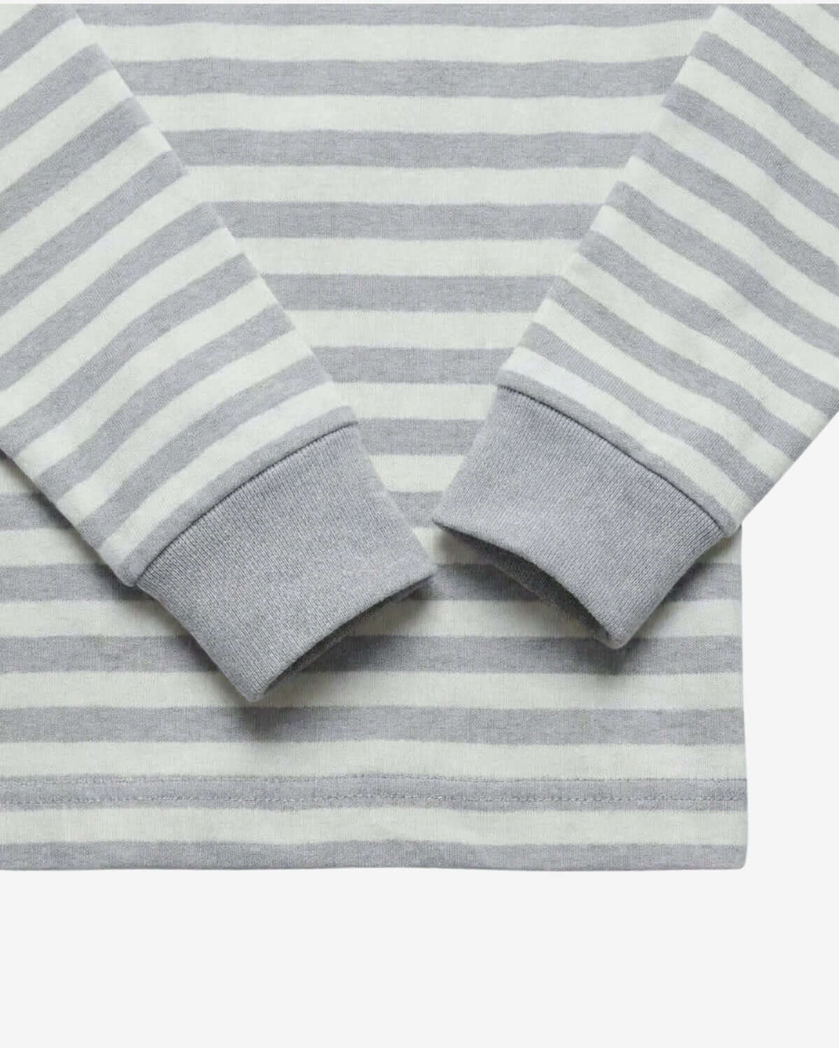 Close-up of a gray and white striped fabric with rolled-up sleeves.