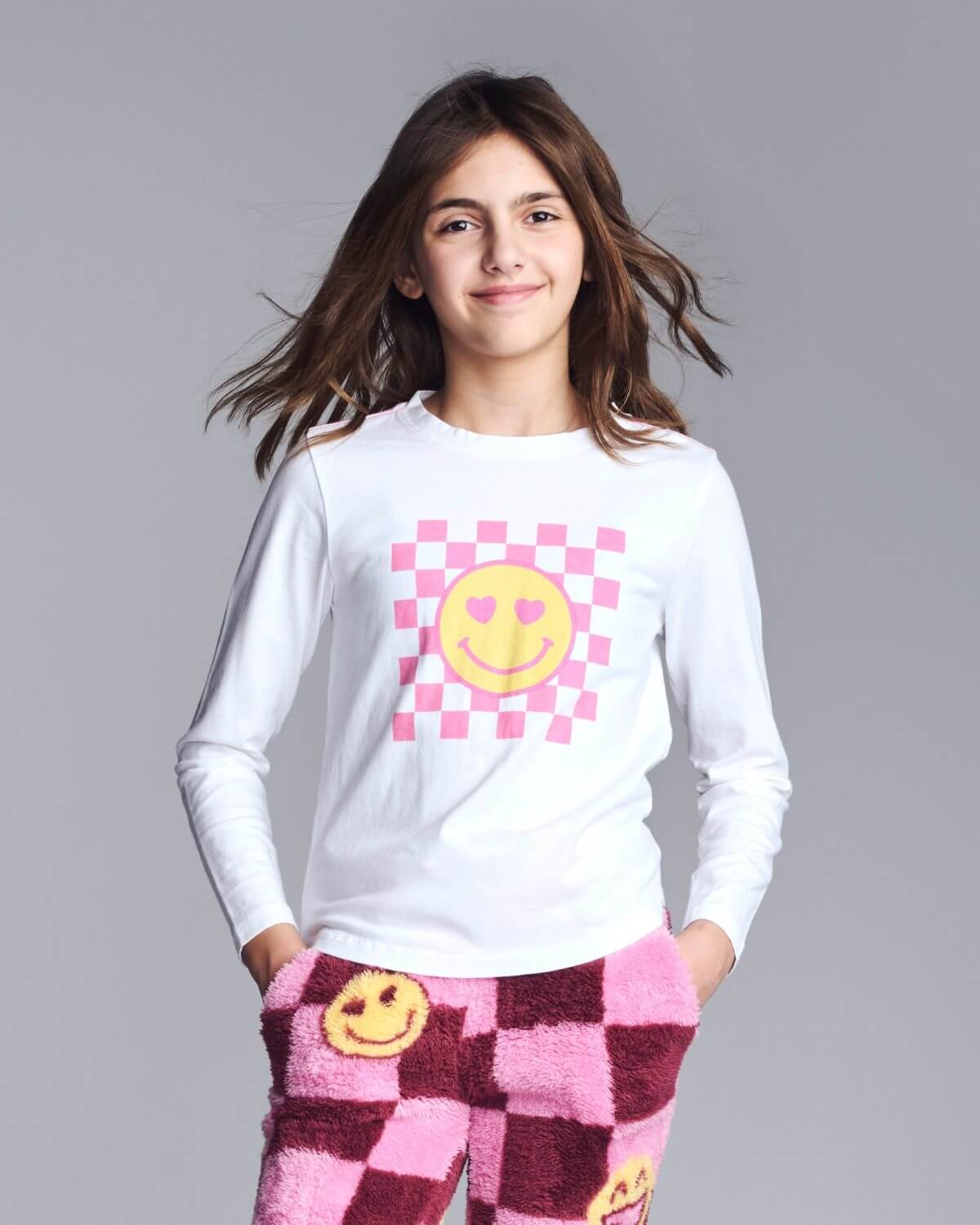 White smiley graphic tee on girl