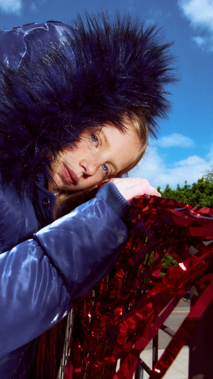 Appaman girls' navy glossy puffer coat sparkle faux fur hood, lifestyle photo.