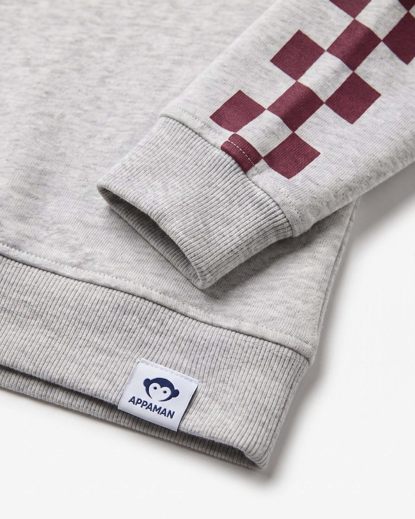 Gray sweatshirt with red checkered pattern on sleeve and Appaman label.