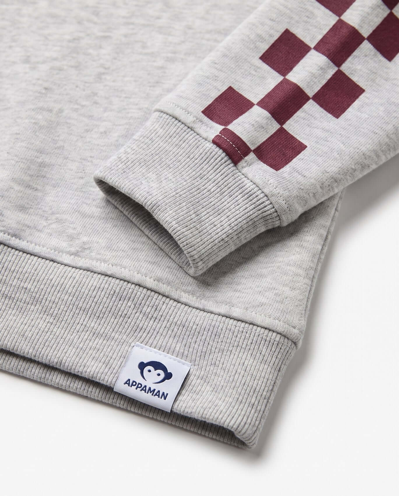 Gray sweatshirt with red checkered pattern on sleeve and Appaman label.