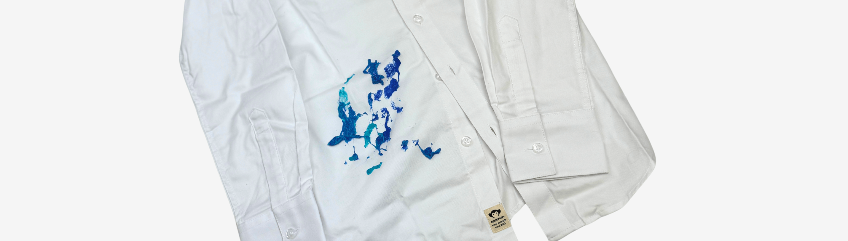 Stylish white shirt with colorful slime stain, perfect for kids’ fashion tips and stain removal solutions.