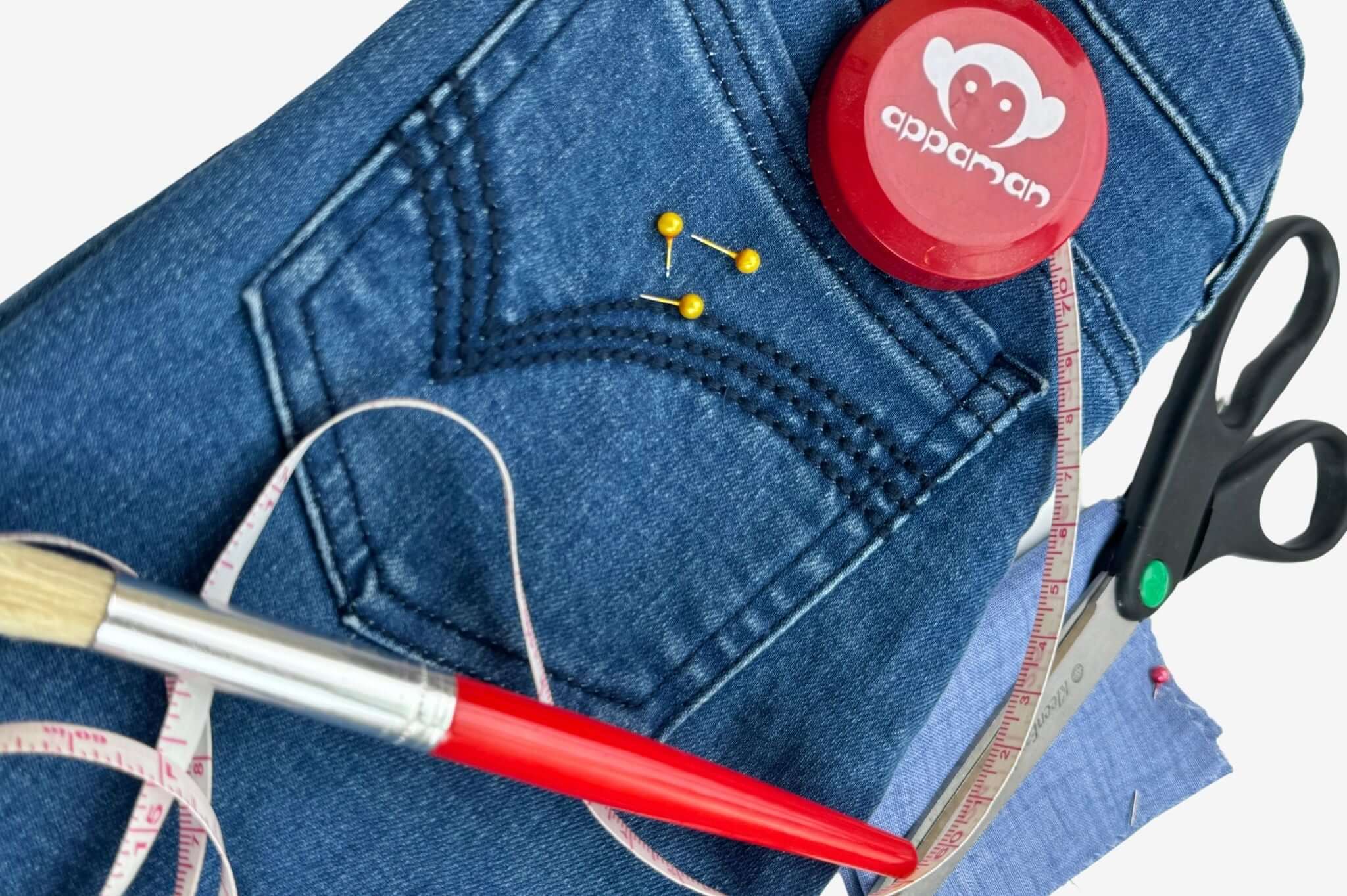 Crafting stylish hand-me-downs with denim and sewing tools for creative kids' outfit transformations.