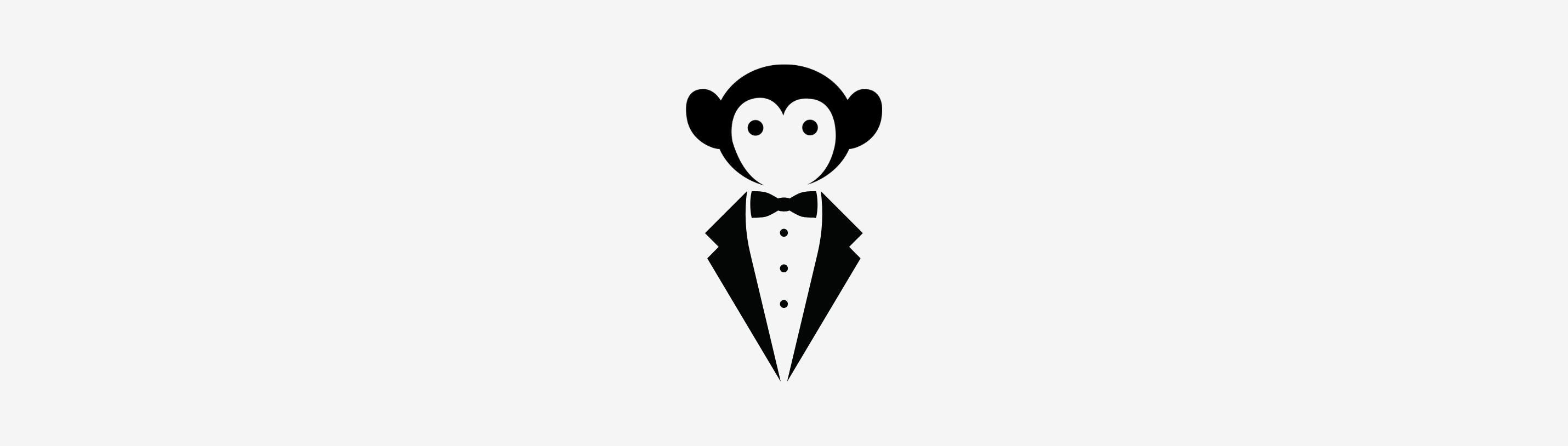 Stylish monkey in a tuxedo, embodying playful sophistication for kids' fashion at events.