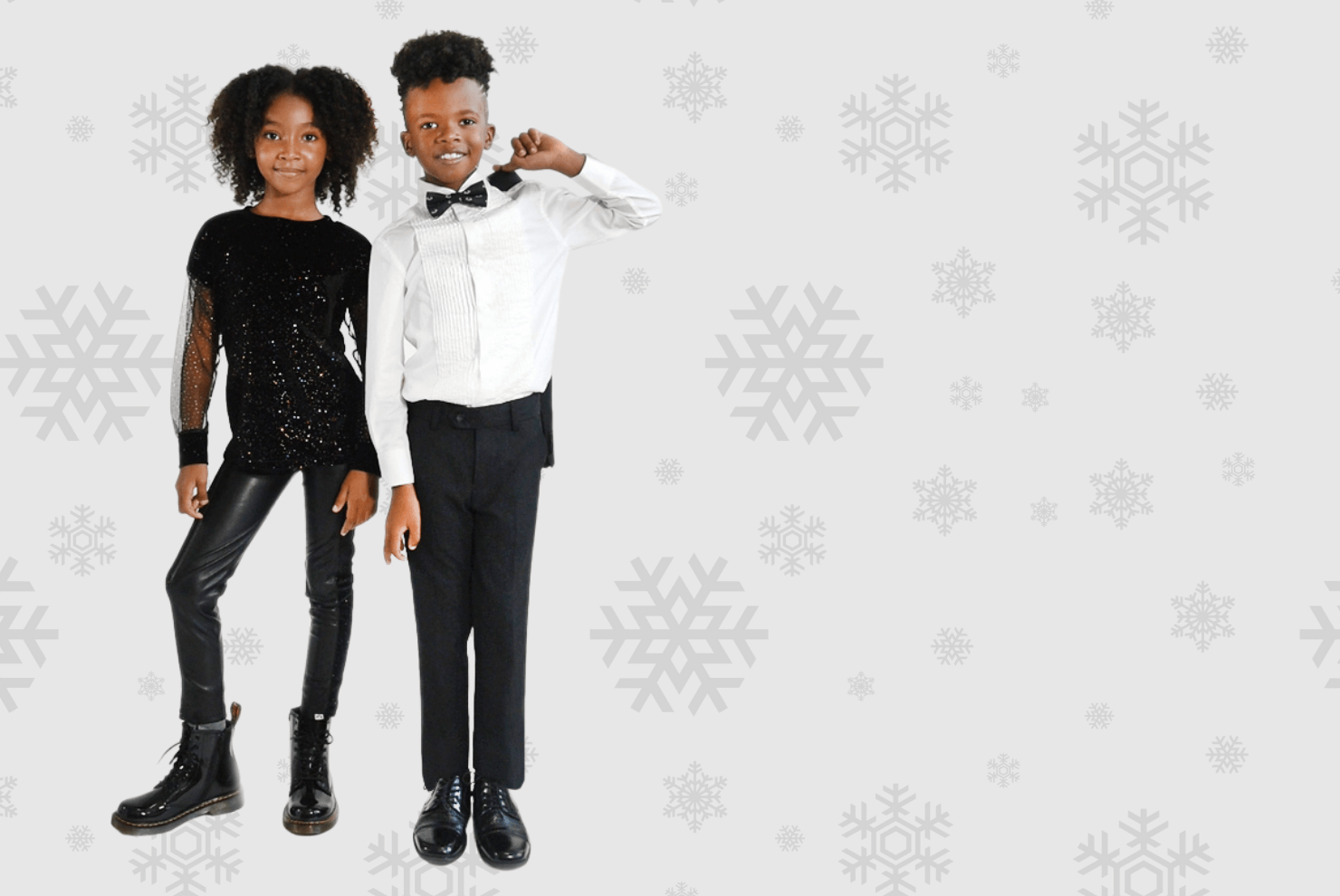 Stylish kids dressed for the holidays: a girl in sequins and a boy in a tuxedo, ready to celebrate in style.
