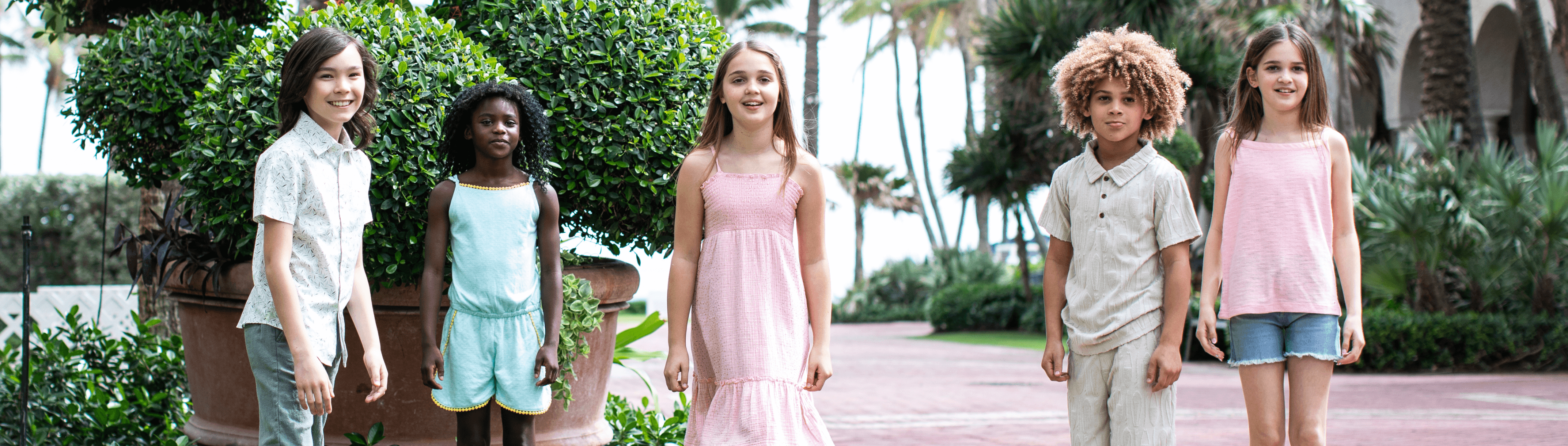 Stylish kids showcase Appaman's fun summer outfits, perfect for adventures under the sun.