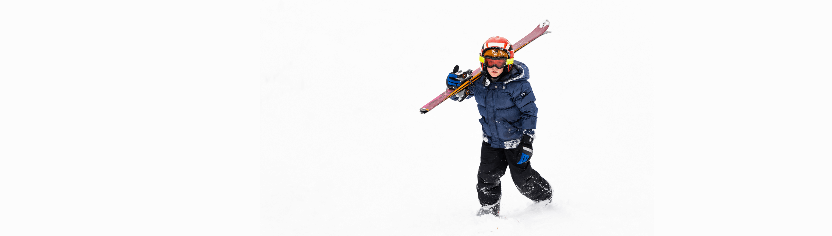 Excited kid in stylish ski gear, ready to hit the slopes with confidence and flair!