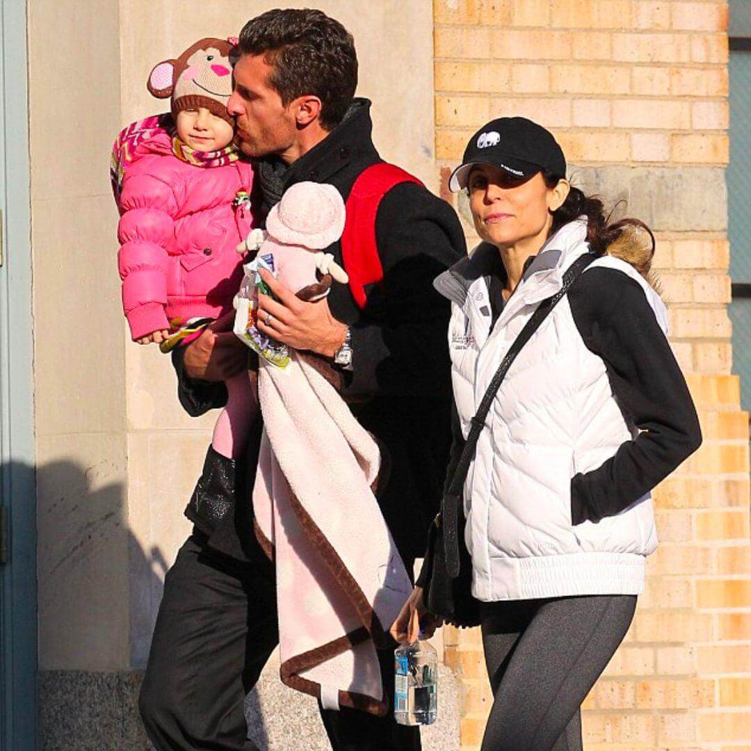 Bethenny Frankel and Jason Hoppy stylishly stroll with daughter Bryn, showcasing kids' winter fashion in Appaman.