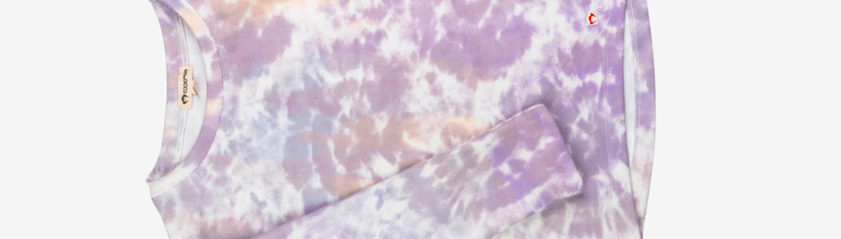 Stylish tie-dye French terry cloth top in pastel purple hues, perfect for trendy kids' casual outfits.